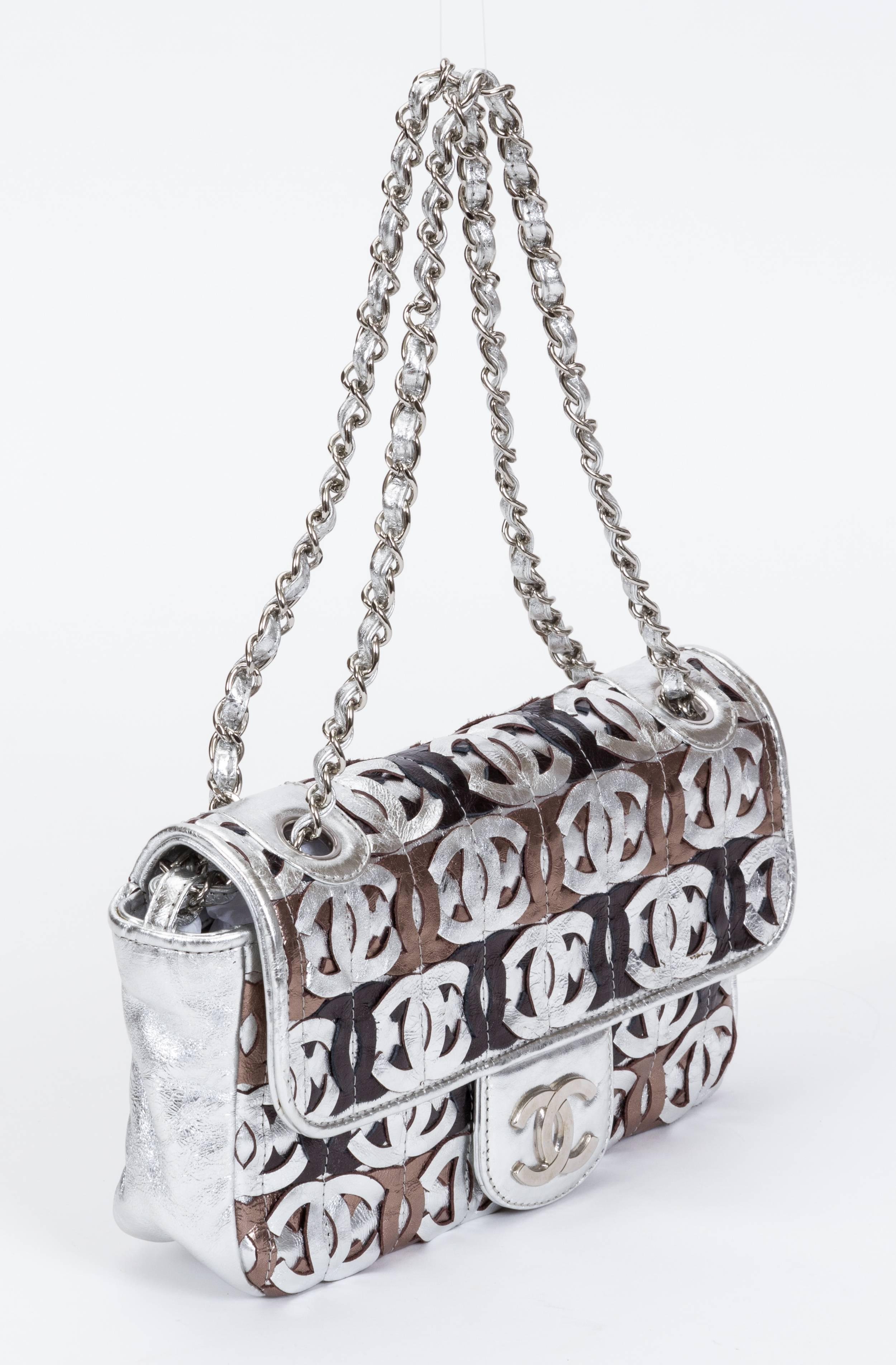 Chanel evening bag in silver and other metallic tones with logo details. Shoulder drop 9
