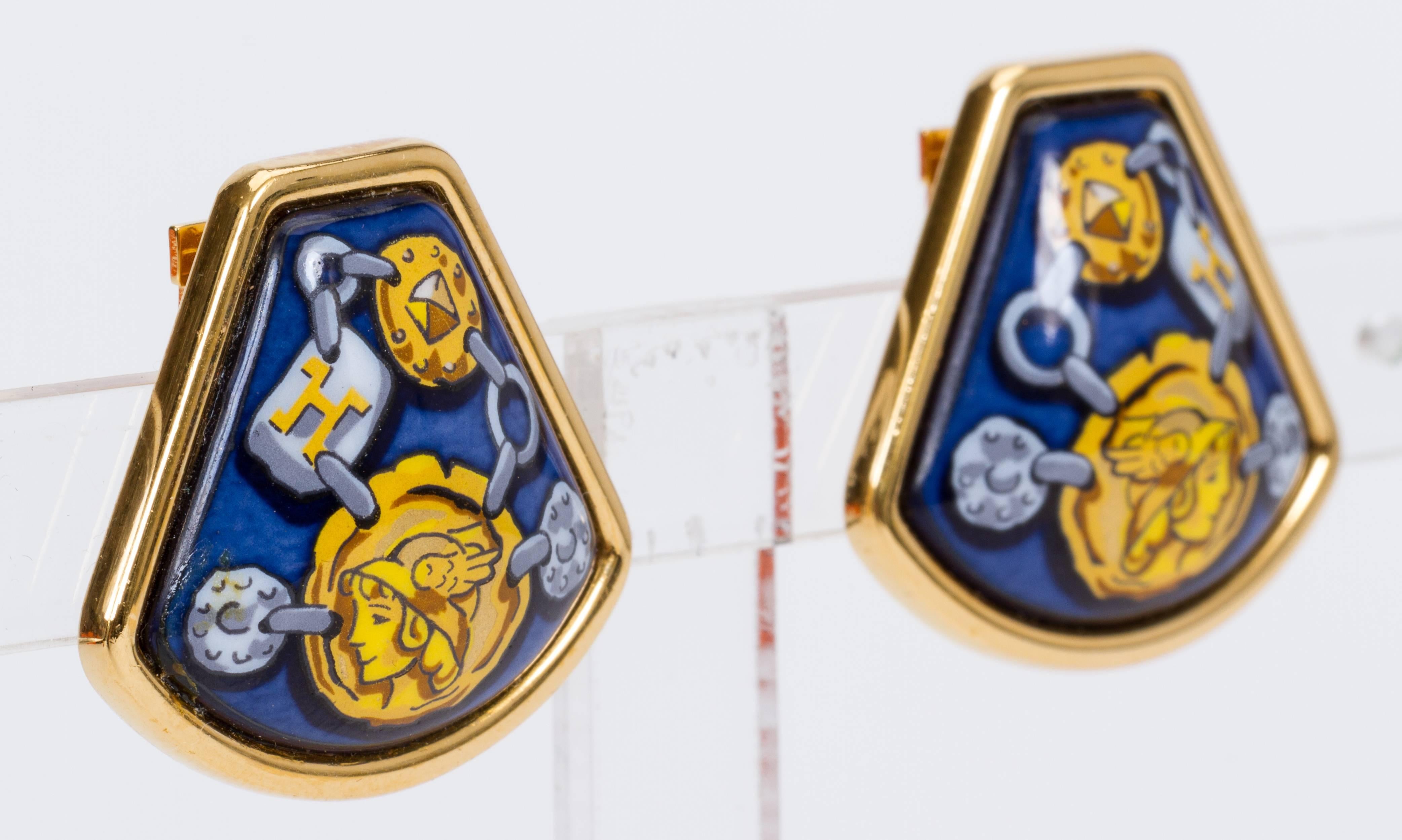 Hermès navy enamel clip earrings with yellow coin design. Come with original box.