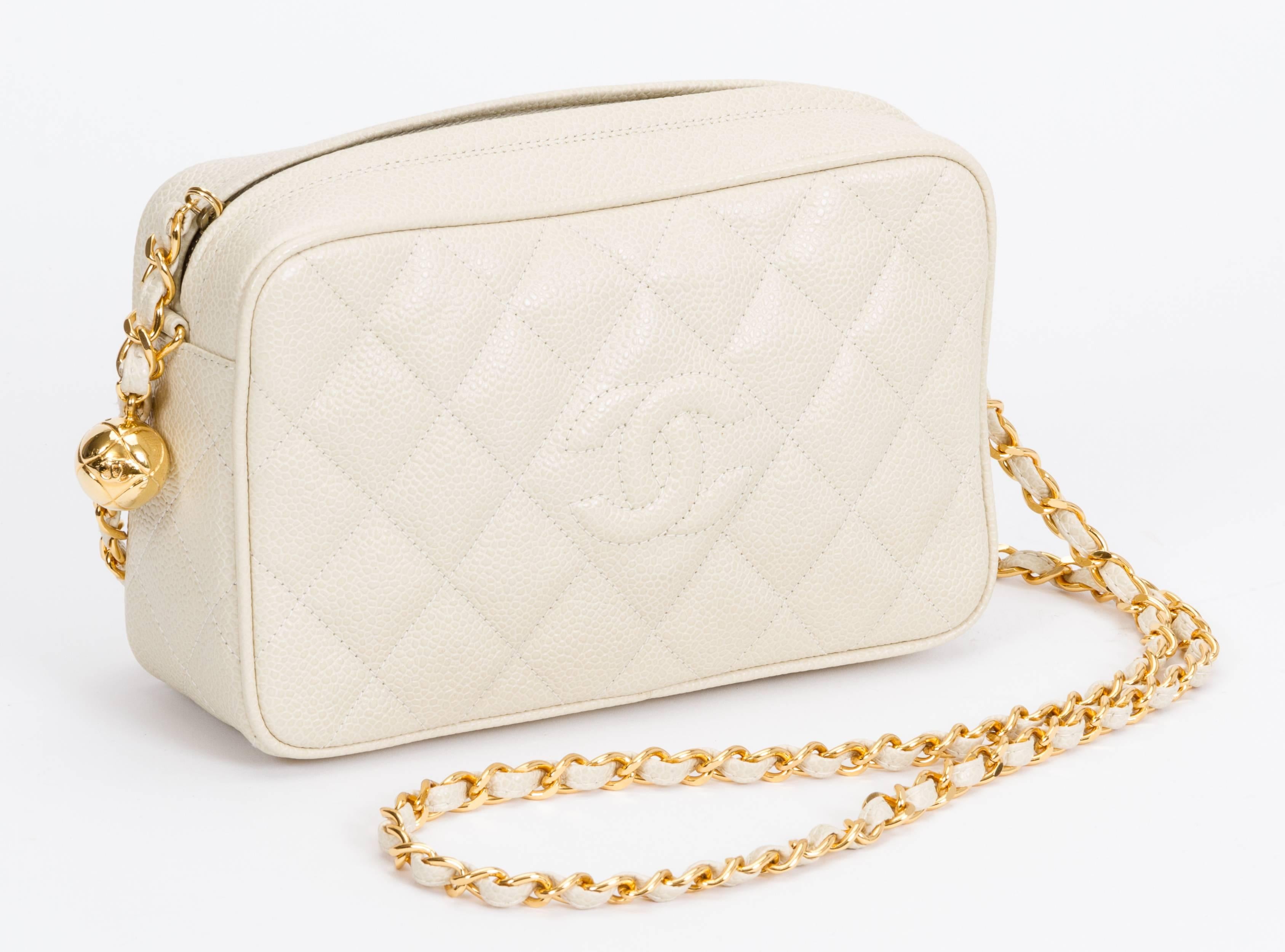 Chanel beige caviar quilted camera bag with gold tone hardware. Cross body, shoulder drop 20