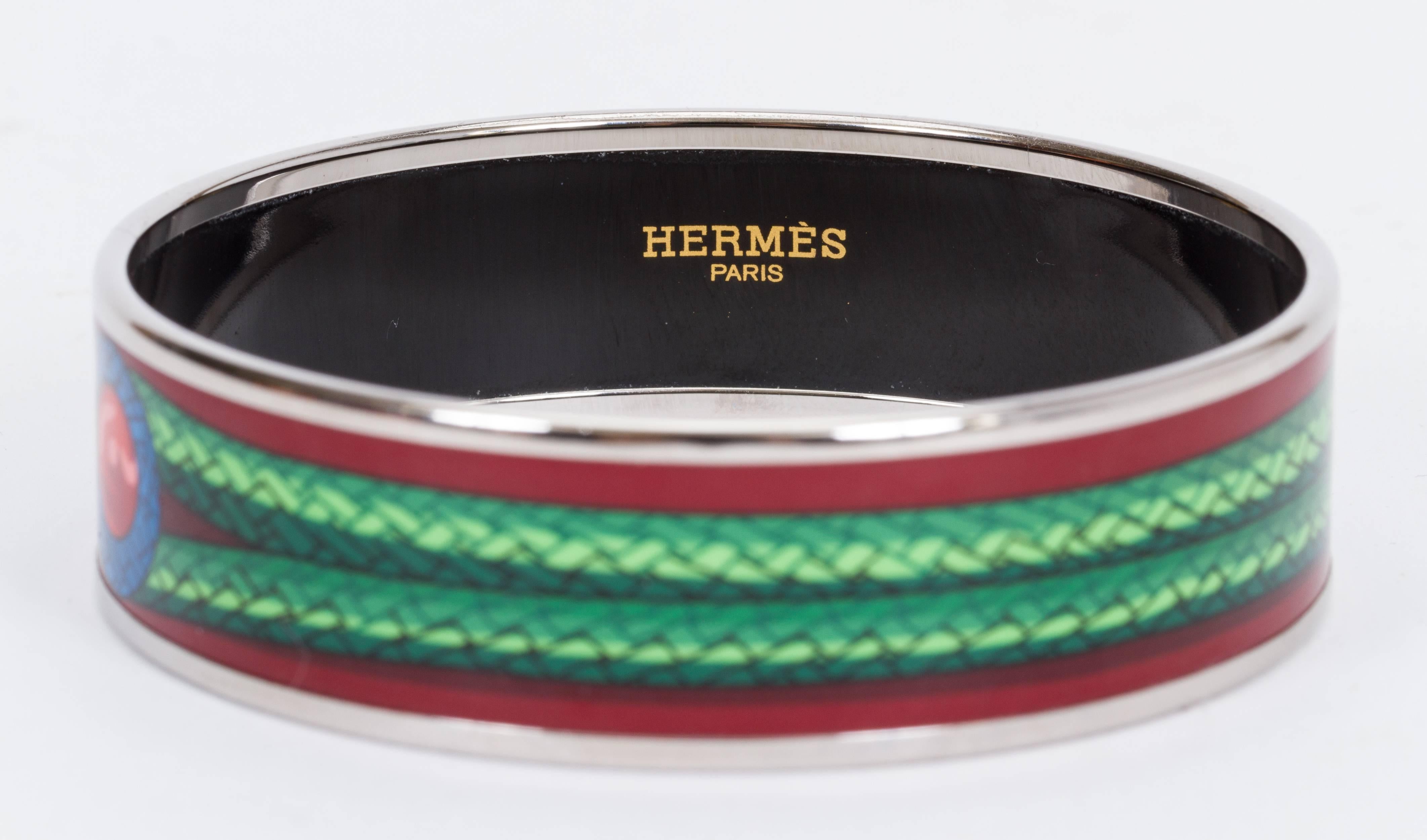 Hermès medium burgundy enamel bangle with knot design. Size small. Interior, 8 1/4