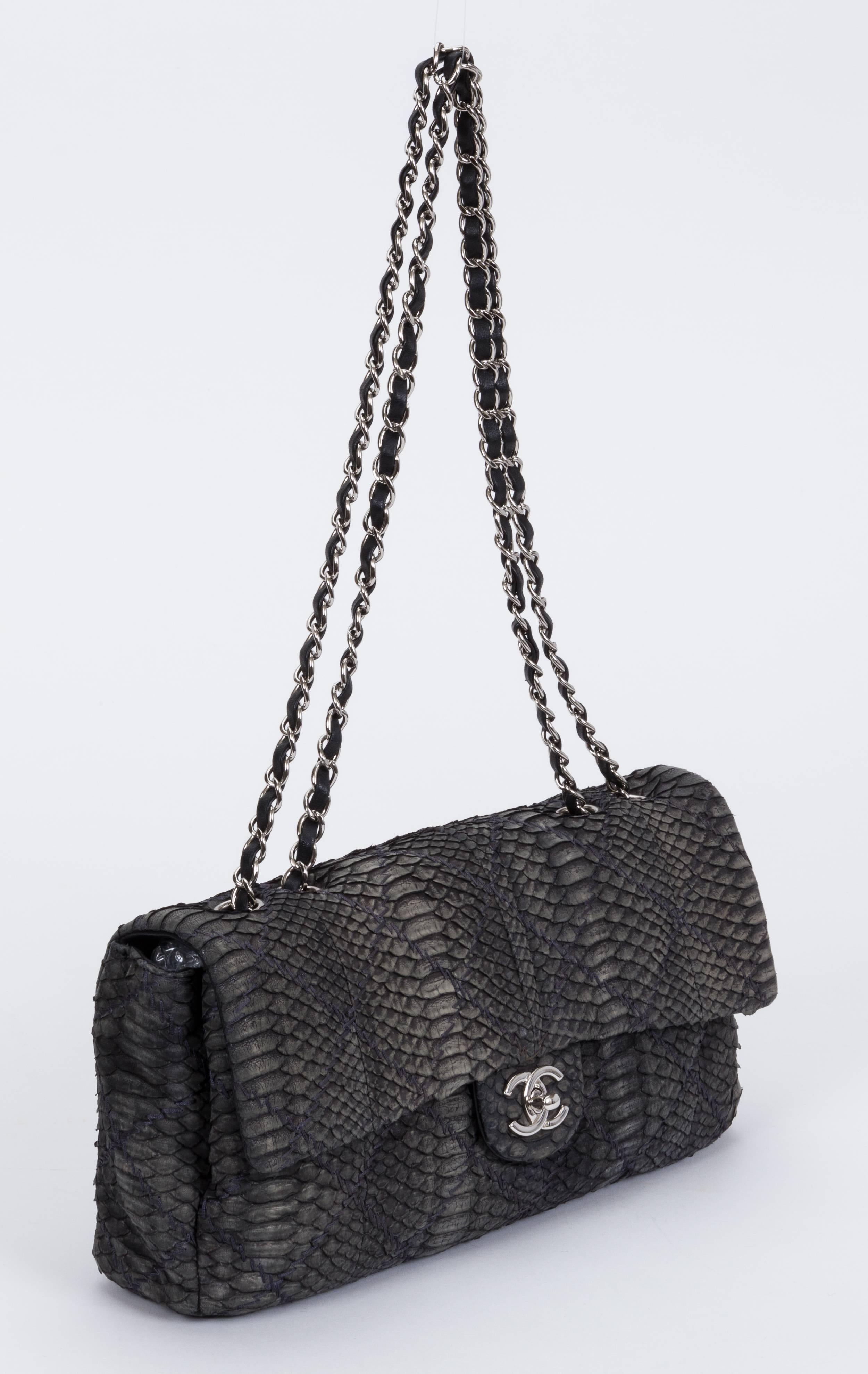 Chanel grey python single flap with two interior compartments. Black lambskin lining. Shoulder drop 12'/21', can also be worn cross body. Comes with hologram, ID card, booklet and dust cover. This item does not ship to California due to Wildlife