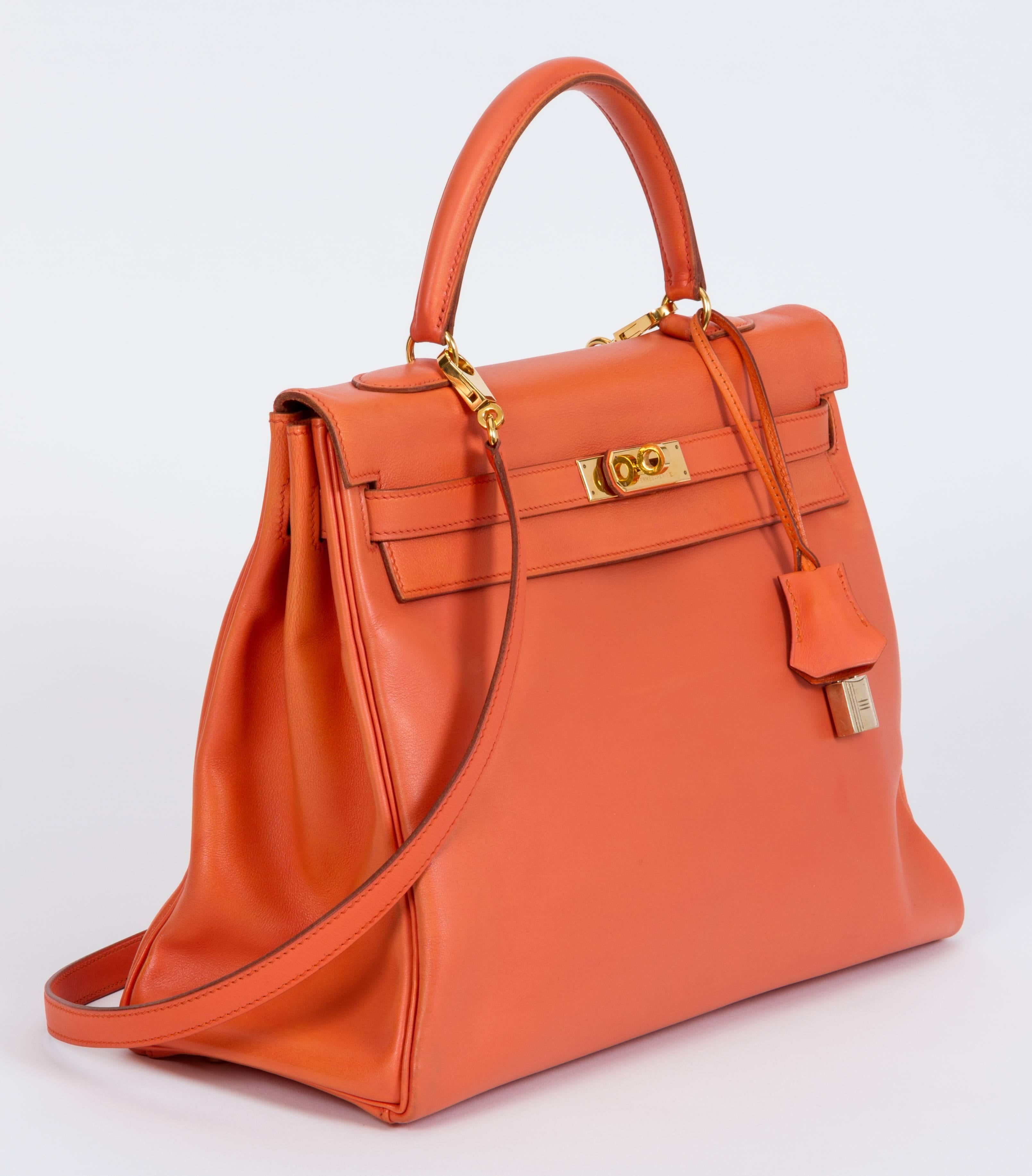 Authentic vintage classic Hermes Kelly bag, 35 cm, in gulliver orange leather and gold tone hardware. Dated Z in a circle for 1996, this bag has been professionally redied. Comes with detachable strap that measures 35