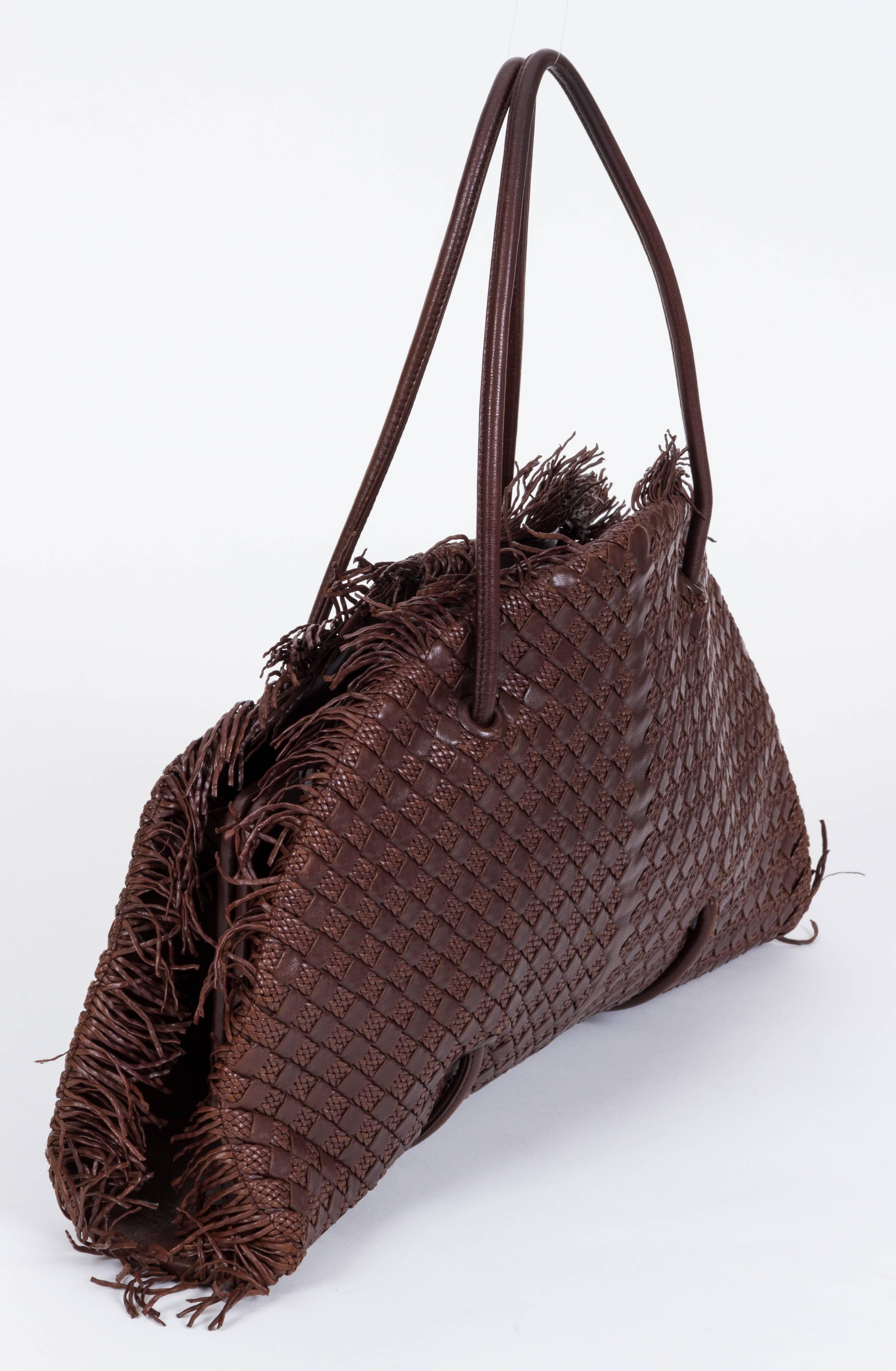 Bottega Veneta limited edition special woven intrecciato supple leather. Numbered item produced in Italy. Minor wear on corners and darkening on interior name plate. Measurements: 17