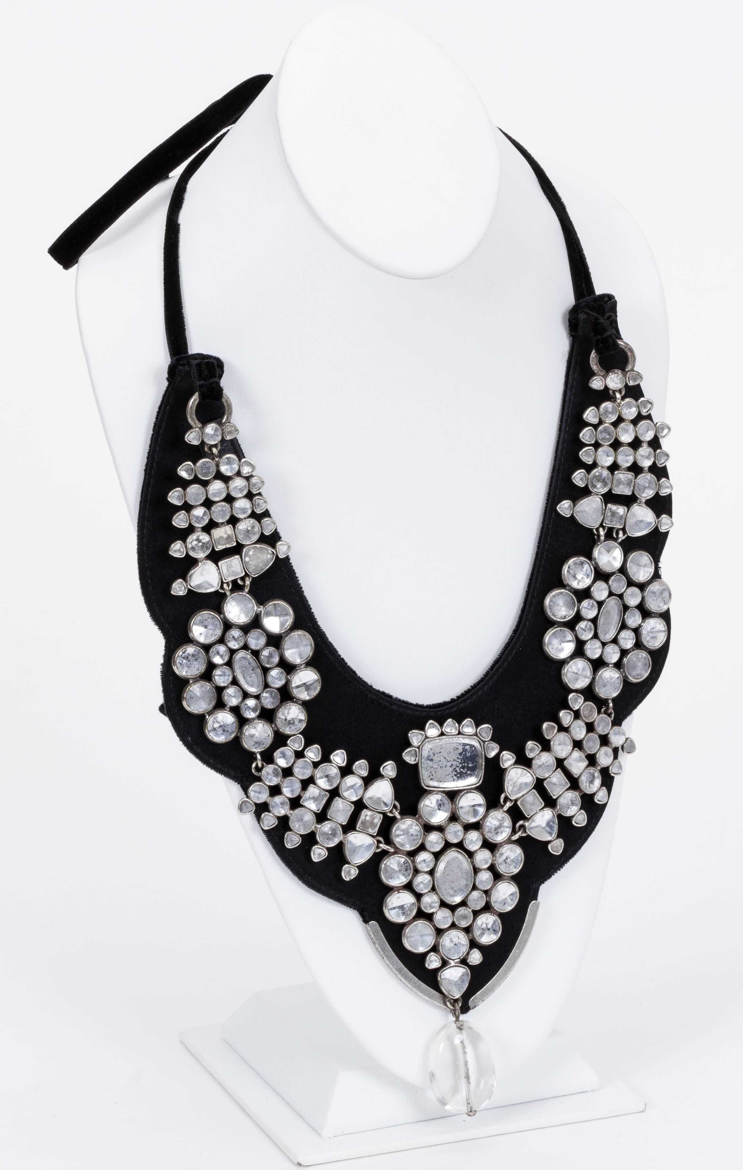 YSL black oversize satin bib necklace with black velvet tie at neck. Detailed in glass rhinestone and bead detail. Comes in original YSL box.

