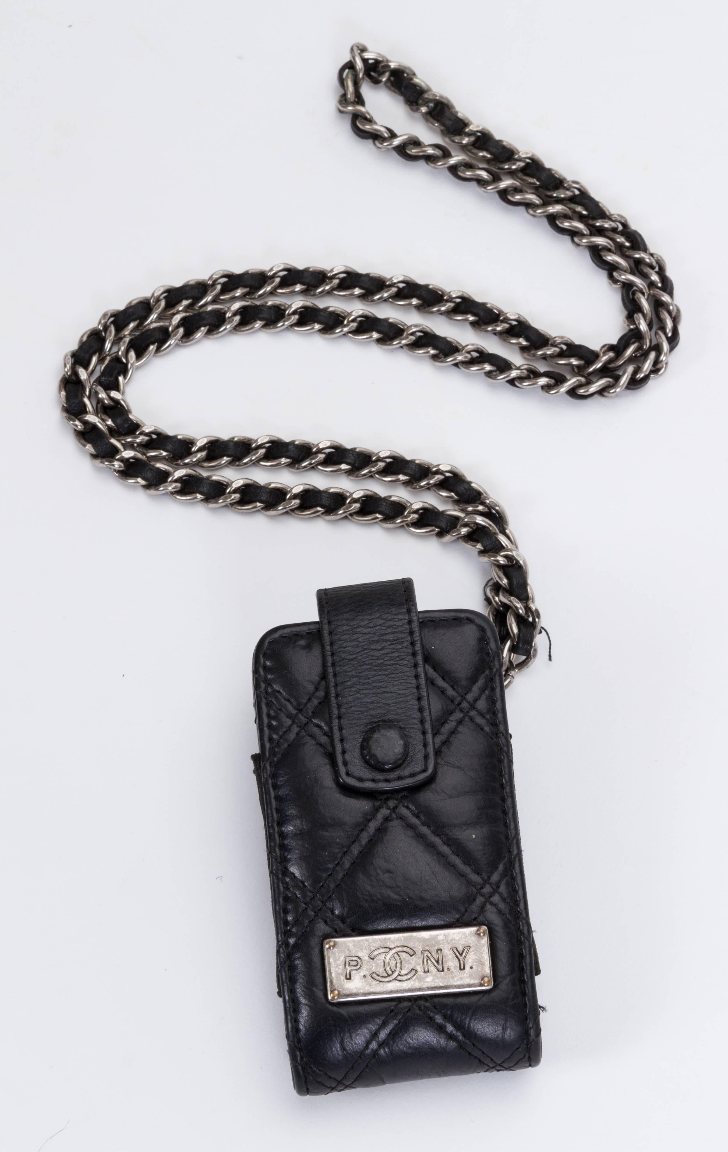 Chanel mini black distressed leather Paris/New York mini bag. Shoulder drop, 16"L. Collection 2005/2006. Comes with hologram and original dust cover.
