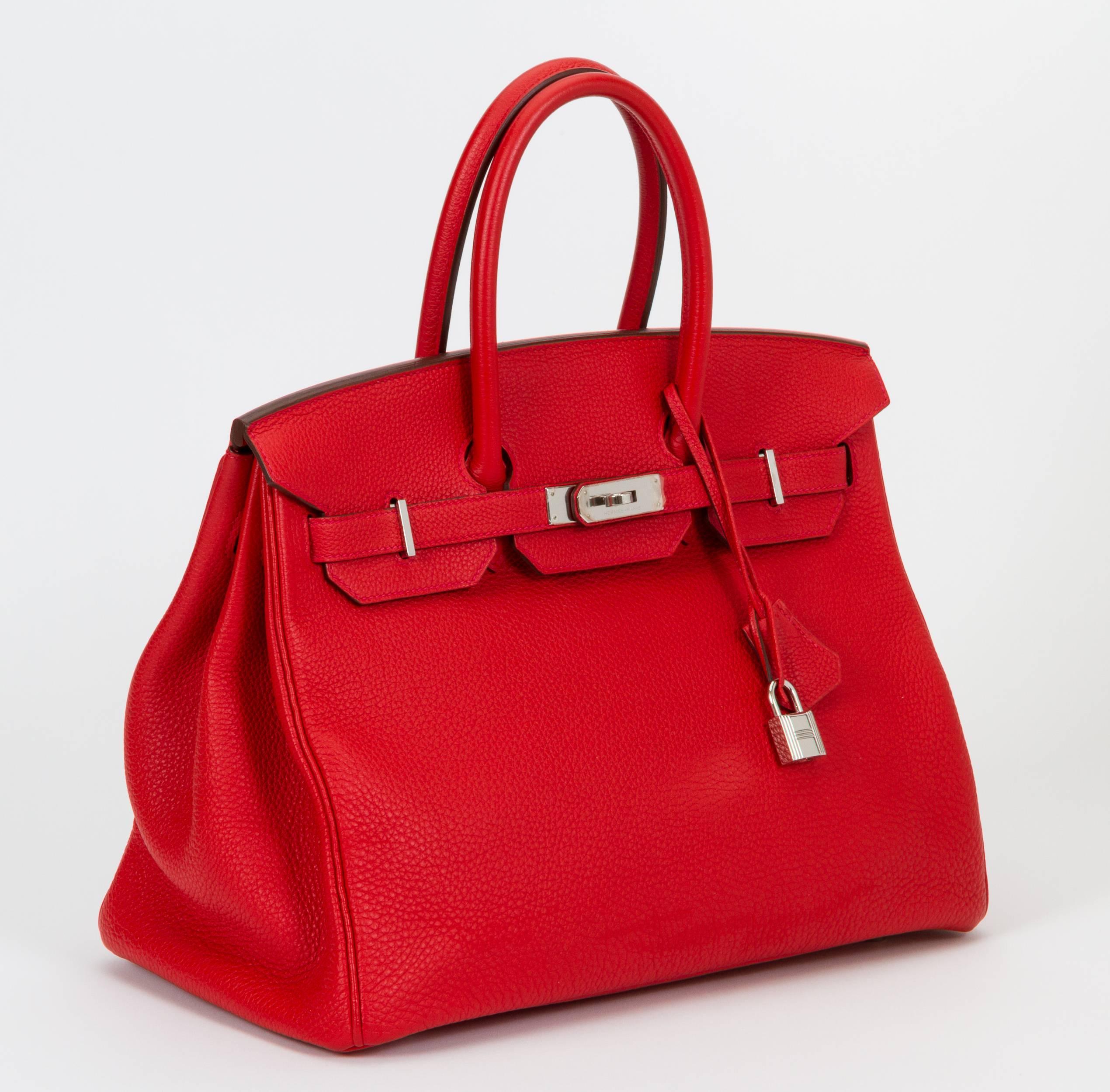 Hermès 35cm Birkin bag in geranium Togo leather with palladium hardware. Plastic on hardware, has been carried a few times. Includes clochette, tirette, lock, keys, rain jacket, and dust bag. Date stamp P in a square for 2012.
