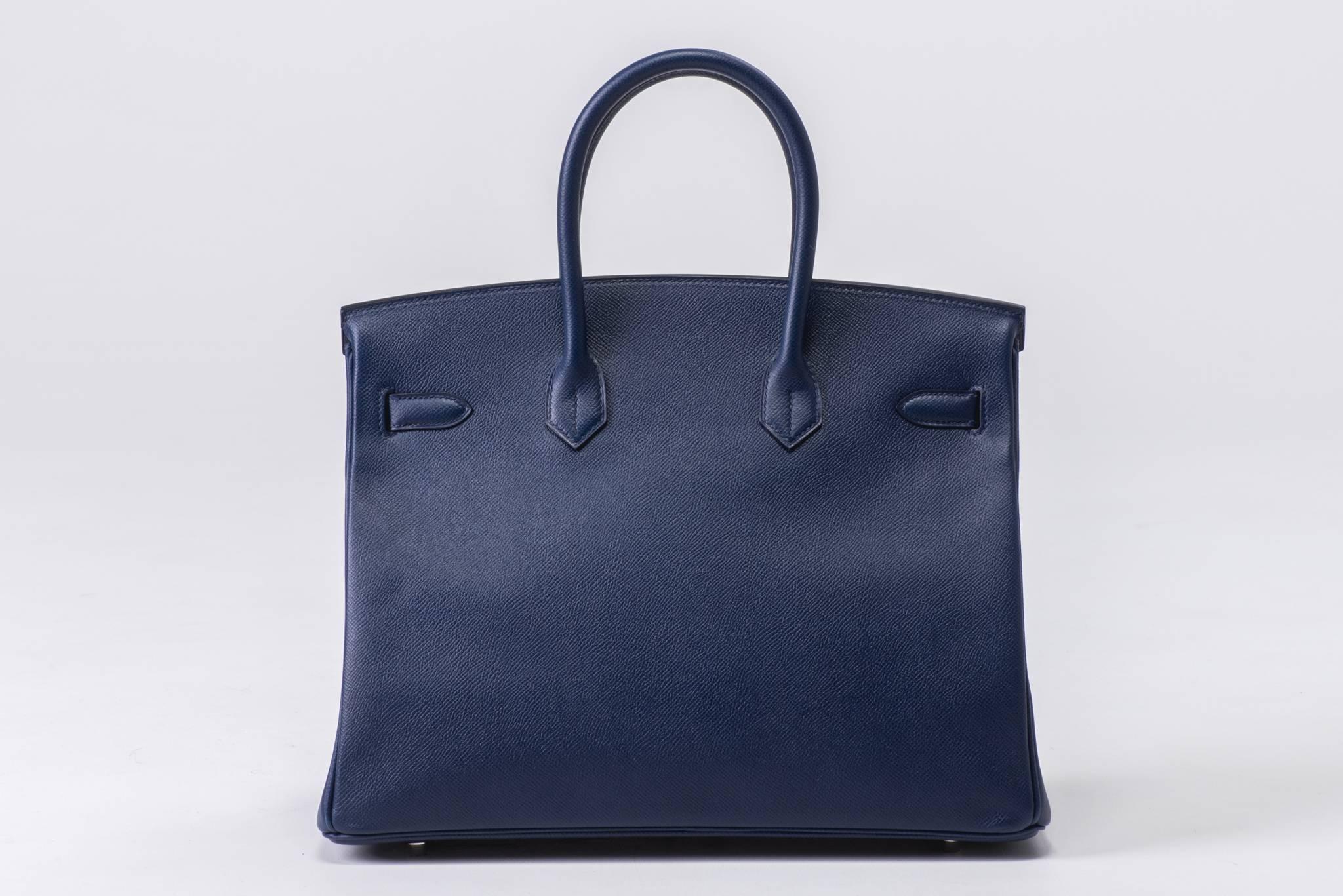 Hermes Birkin 35 blue sapphire epsom leather with palladium hardware. Partial plastic on metal parts, bag has been carried a handful of times only. Excellent condition except front dent shown in main photo. Handle drop 4.5