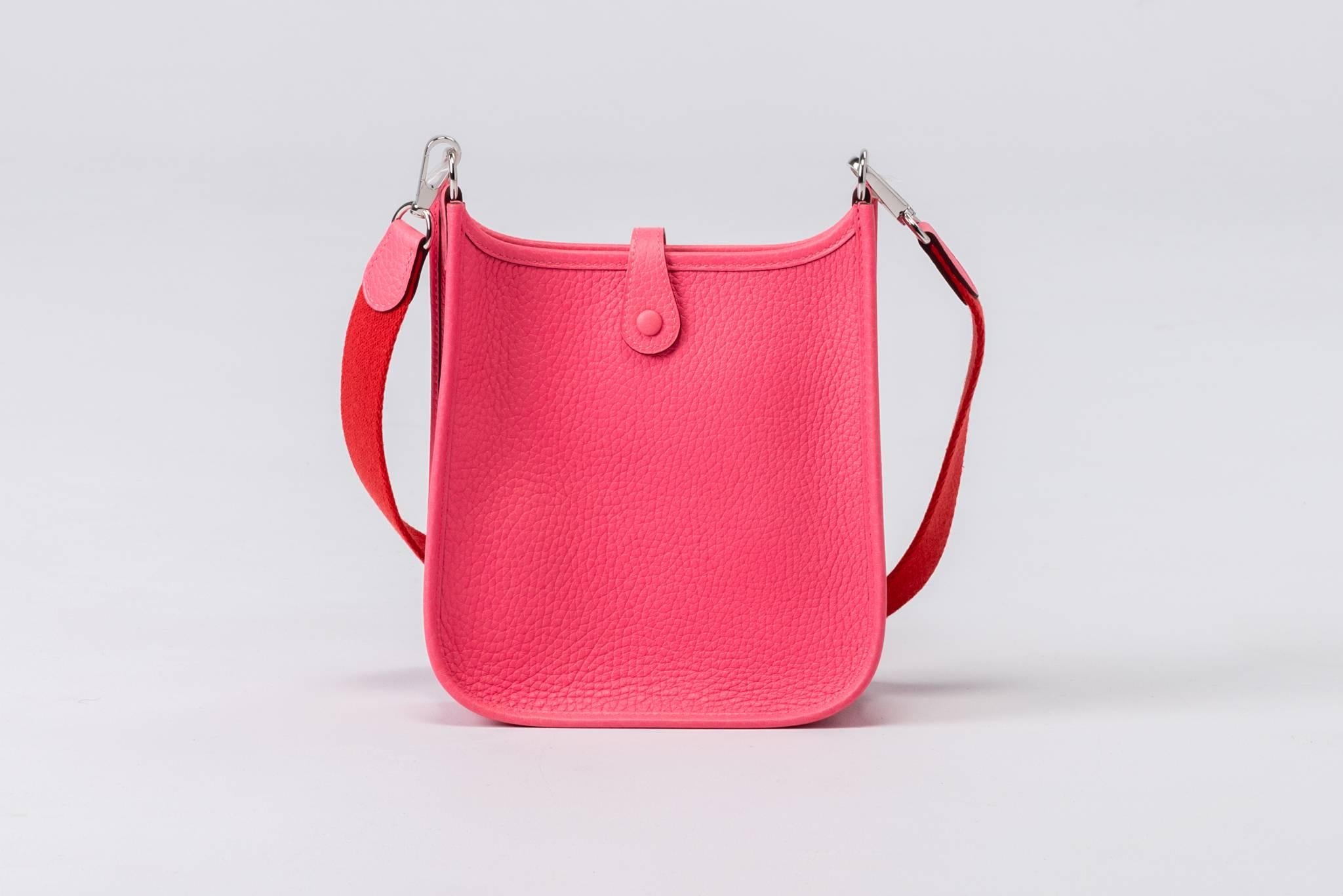 Hermès mini Evelyne shoulder bag in rose azalee clemence leather with palladium hardware. Two tone rose azalee strap/rouge pivoine. Never used. Dated 