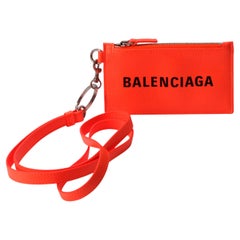 Tarjetero con correa de Balenciaga, naranja, nuevo y sin usar