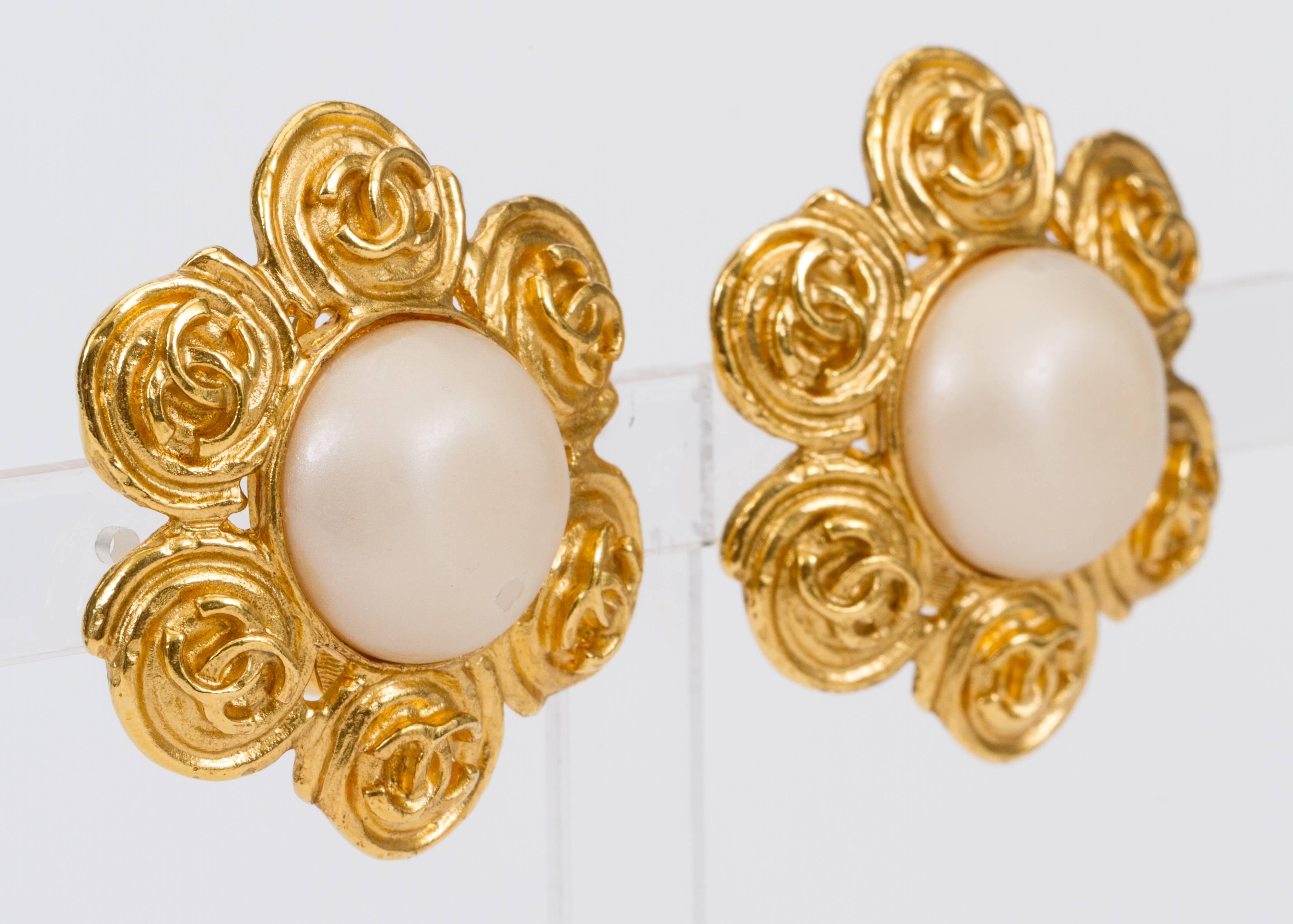 Chanel large flower earrings with center pearl. Minor scuff on one pearl. Collection spring 94. Come with original box.