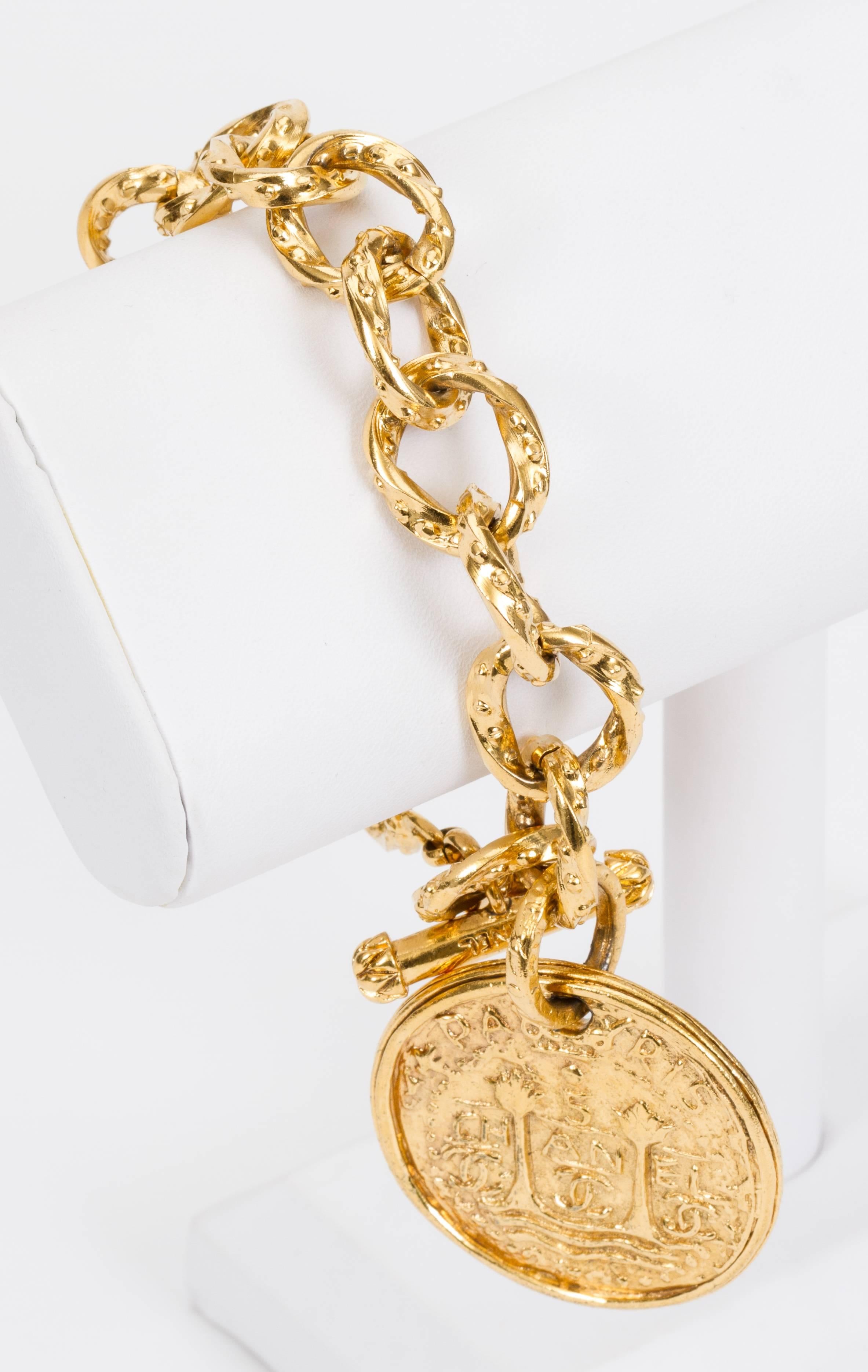 Chanel goldtone bracelet with oversize tarot coin charm. Autumn '93 Collection. Comes with original box.