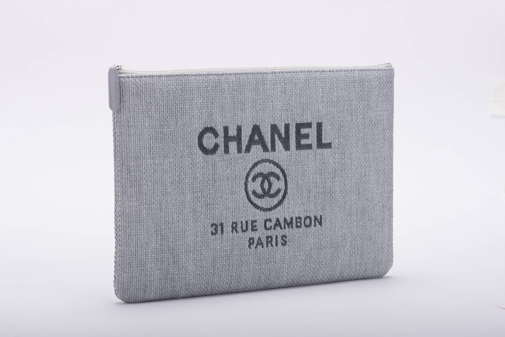 Chanel brand new in box blue linen clutch. Signature logo and Cambon store address. Comes with hologram, ID card, booklet, box and ribbon.