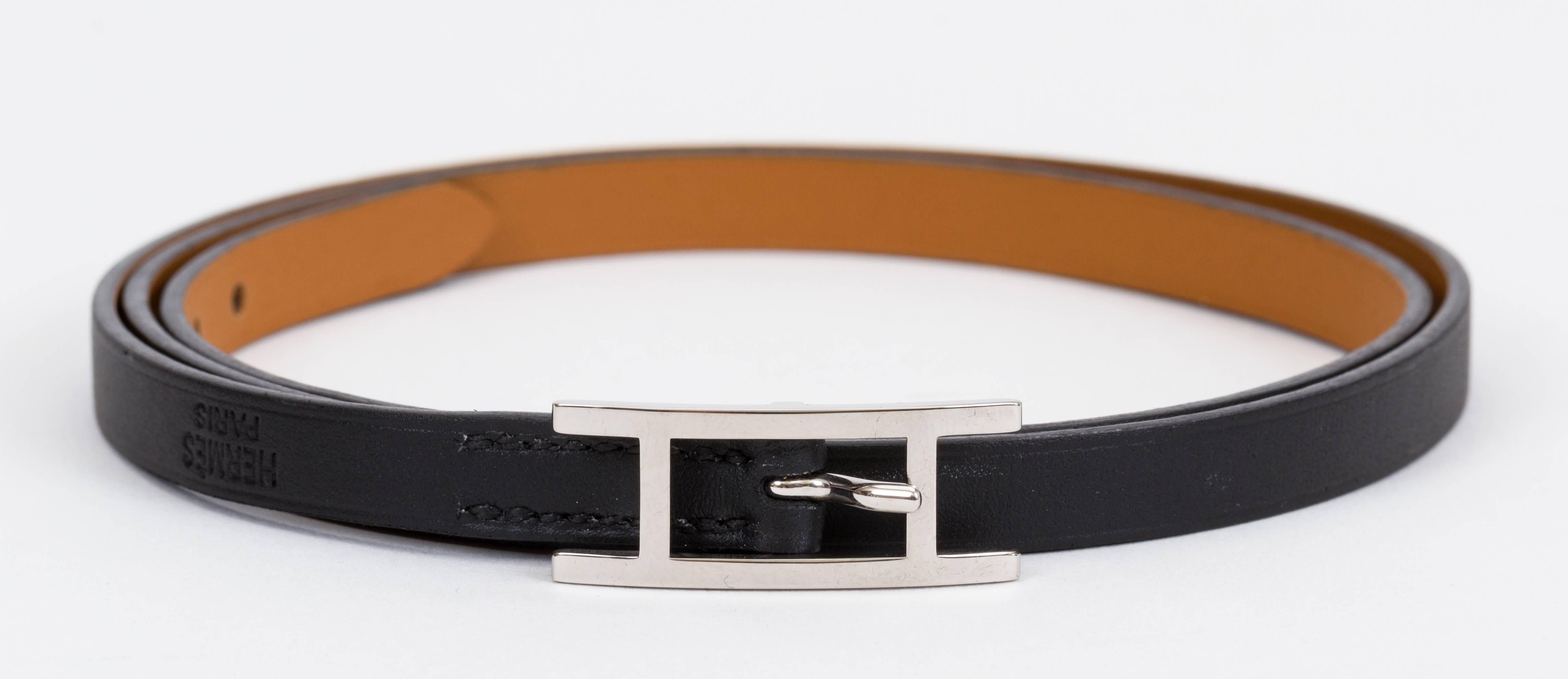 Hermes versatile long double sided leather bracelet, black and gold with palladium clasp. Size medium can be wrapped up to 4 times. Brand new comes with box and ribbon.
