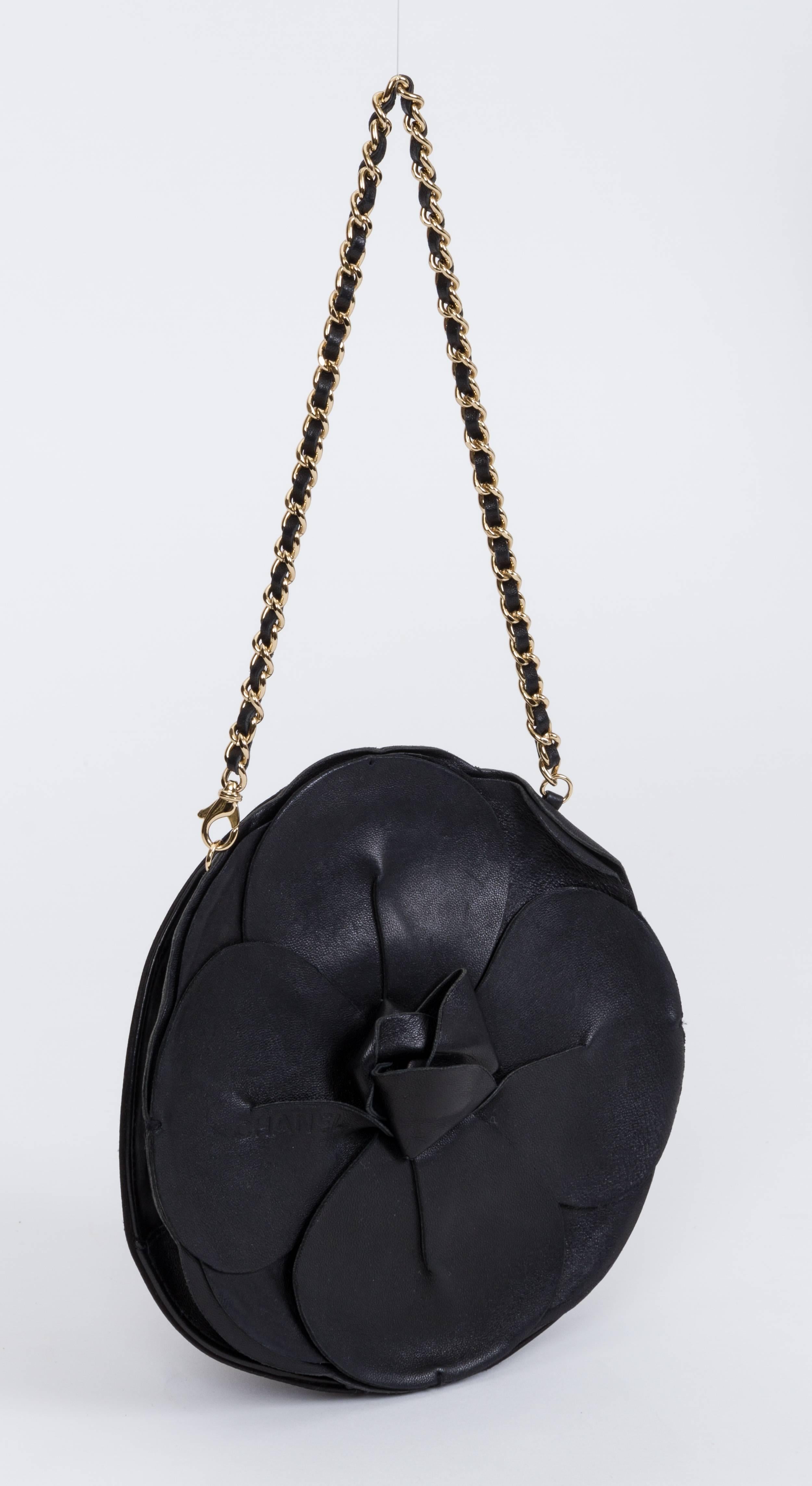 Chanel evening bag shaped as a camellia flower, black leather and black silk combination. Can be worn with or without the strap. Shoulder drop 7.5