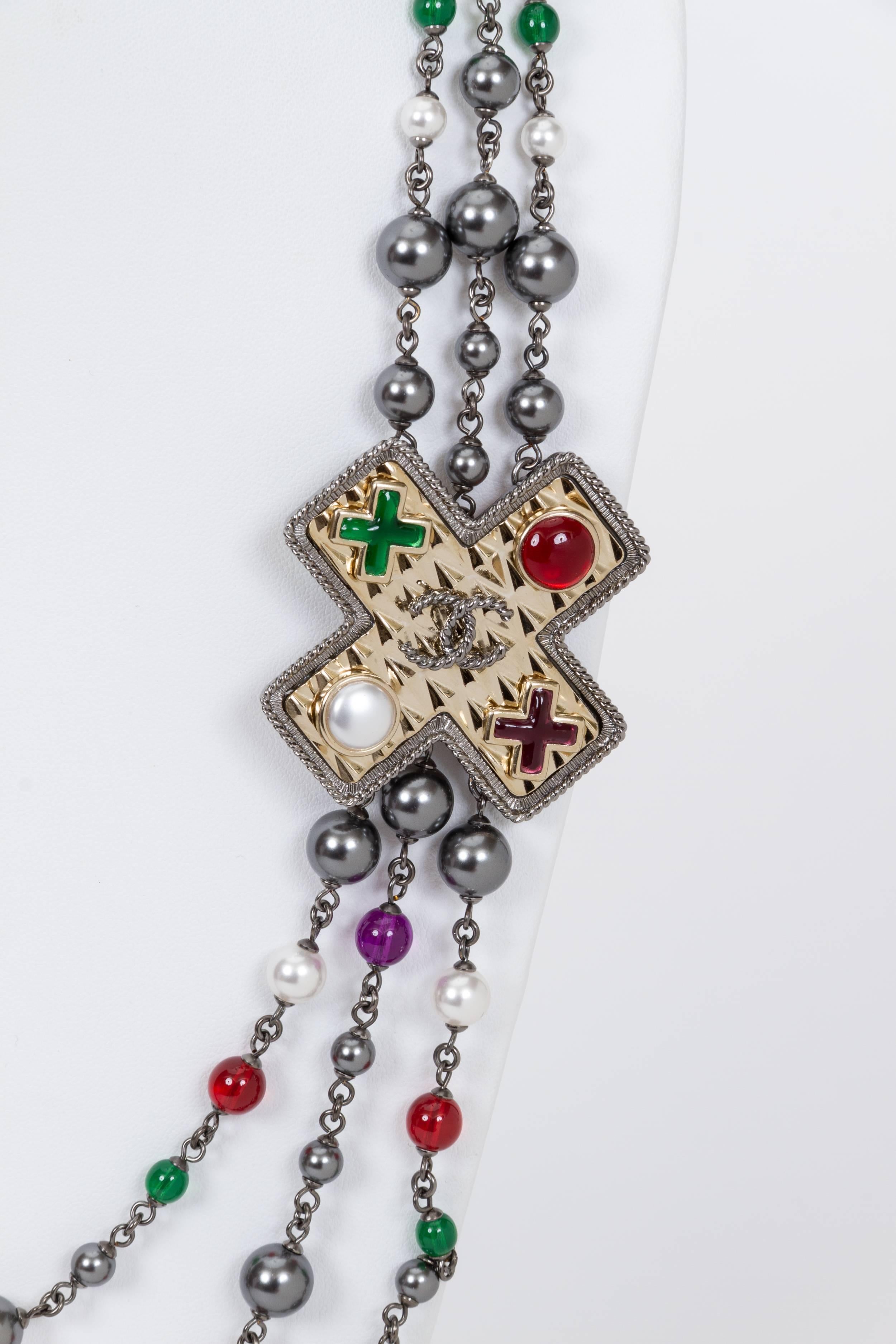 Chanel brand new in box triple strand necklace with accent Maltese cross on the side. Gunmetal with grey pearls and red, green and purple gripoix beads. Spring 2017 collection. Unworn, comes with original tag, velvet pouch and box.