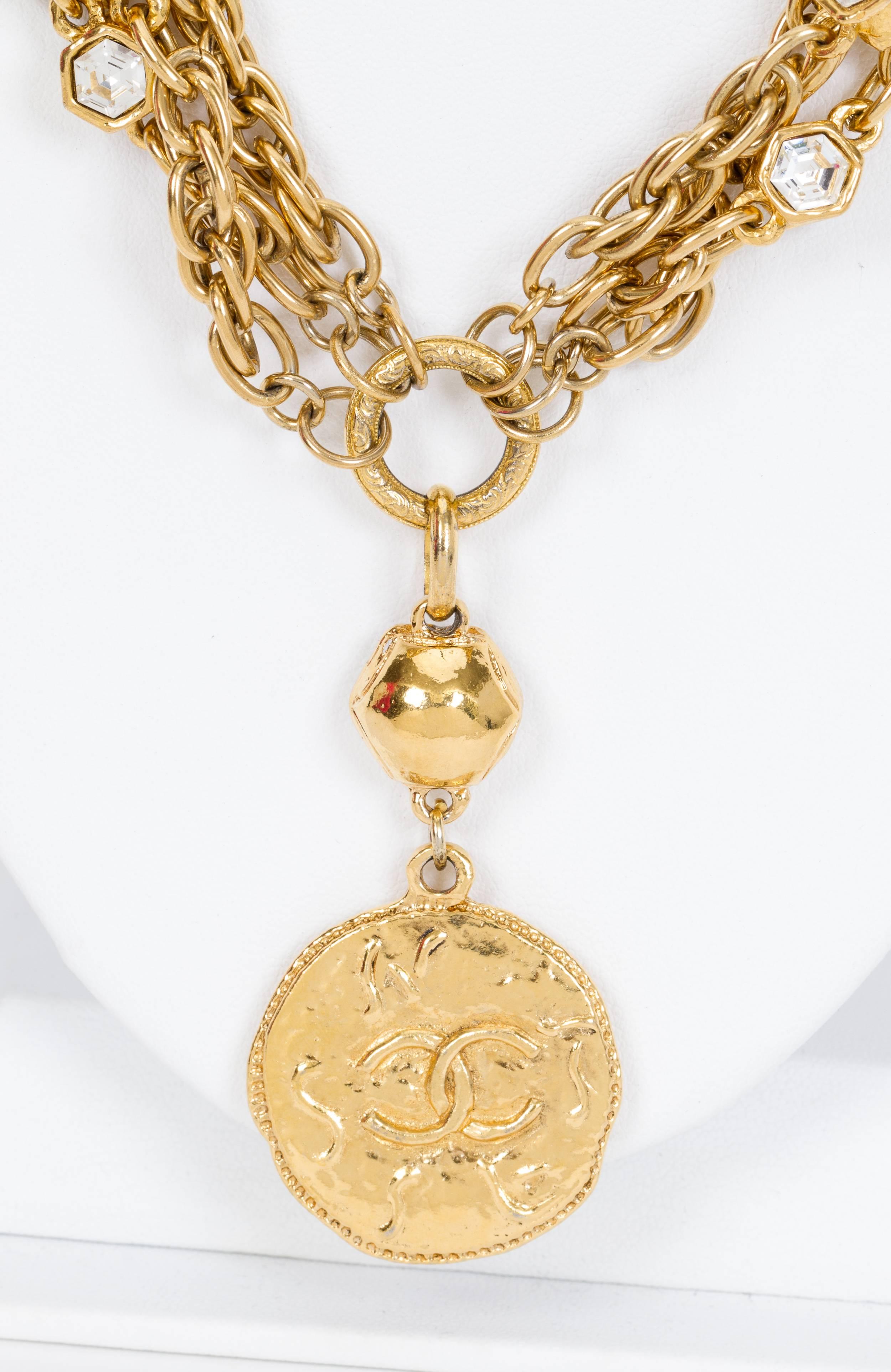 Chanel rare triple strand crystal necklace with center coin pendant. 70's collection. Comes with original box.