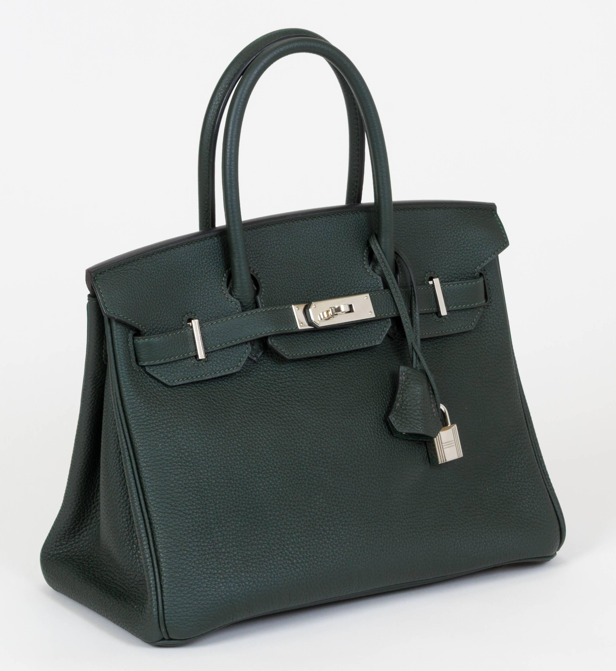 Hermes authentic Birkin 30 vert anglais togo leather and palladium hardware. Partial plastic still on 2 feet, worn very little.  X stamp for 2016. Handle drop 4". Comes with full set: clochette, tirette, lock, keys, dust cover, rain jacket,