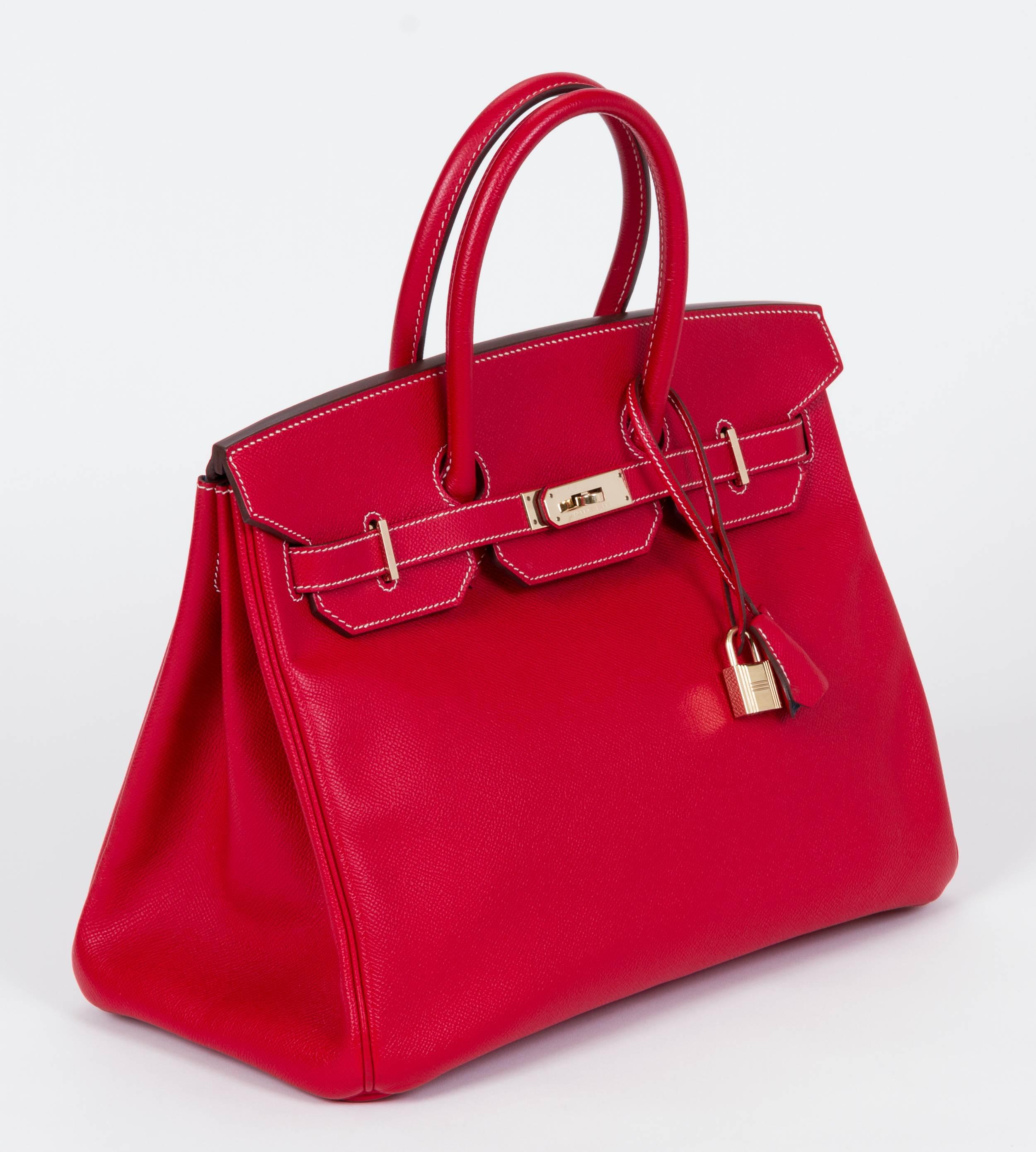 Hermes rare and collectible candy color collection Birkin bag 35 cm in rouge casaque epsom leather/talahasa blue goatskin and goldtone hardware. Date stamp P for 2012. Handle drop 4.25