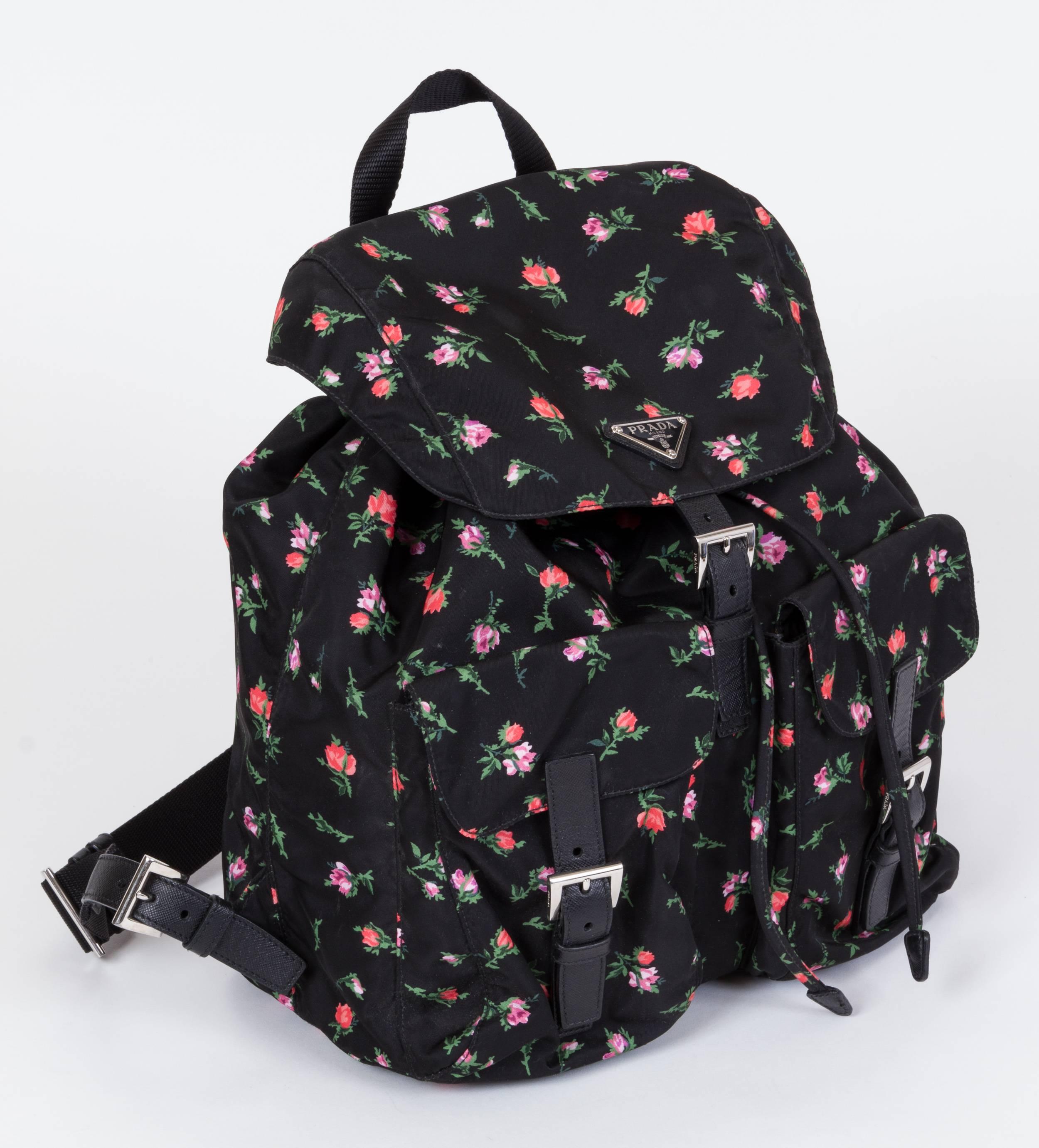 Prada black nylon backpack with pink rosettes and saffron leather details. Handle drop 3