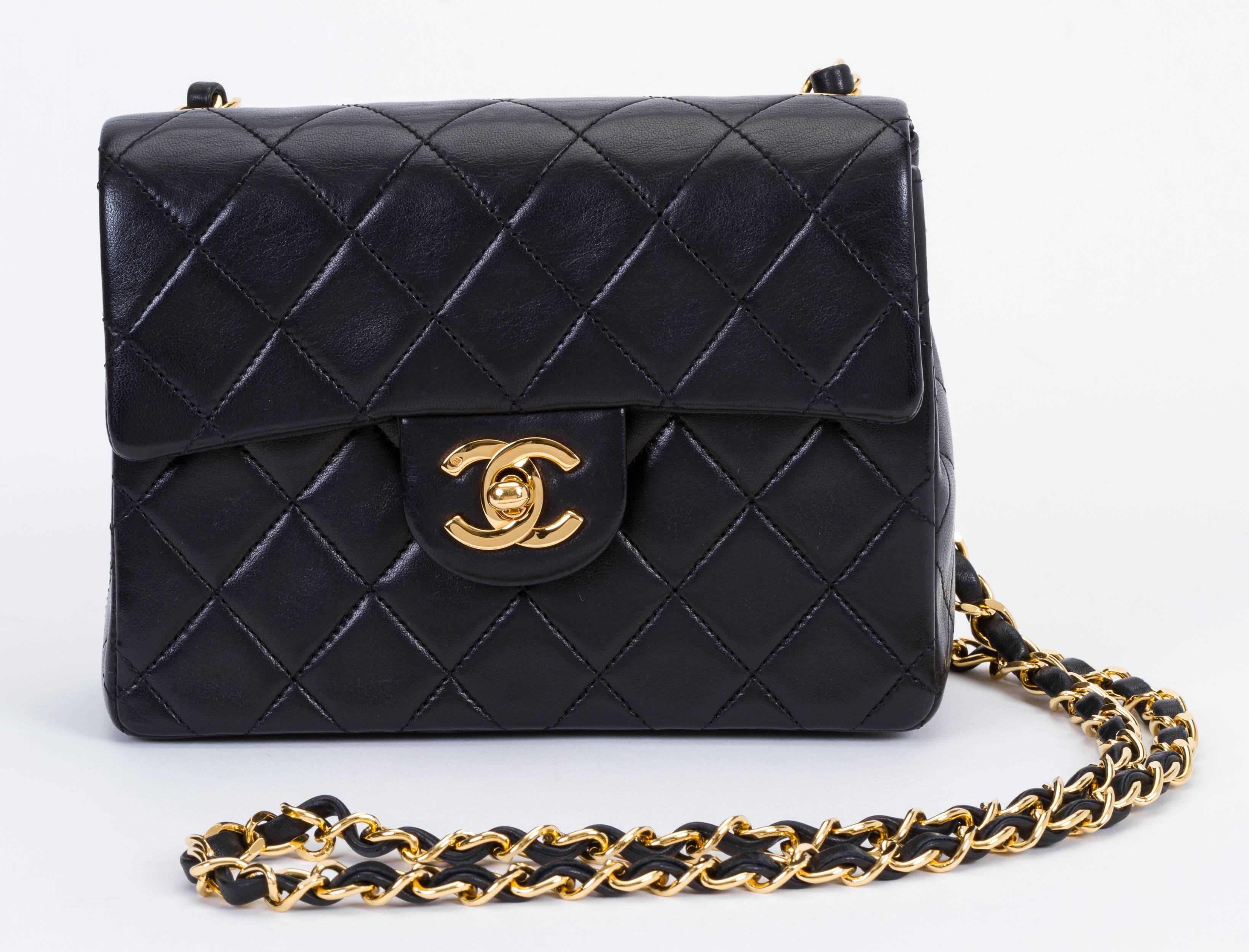 Chanel mini classic black lambskin quilted flap with gold tone hardware. Shoulder drop 21