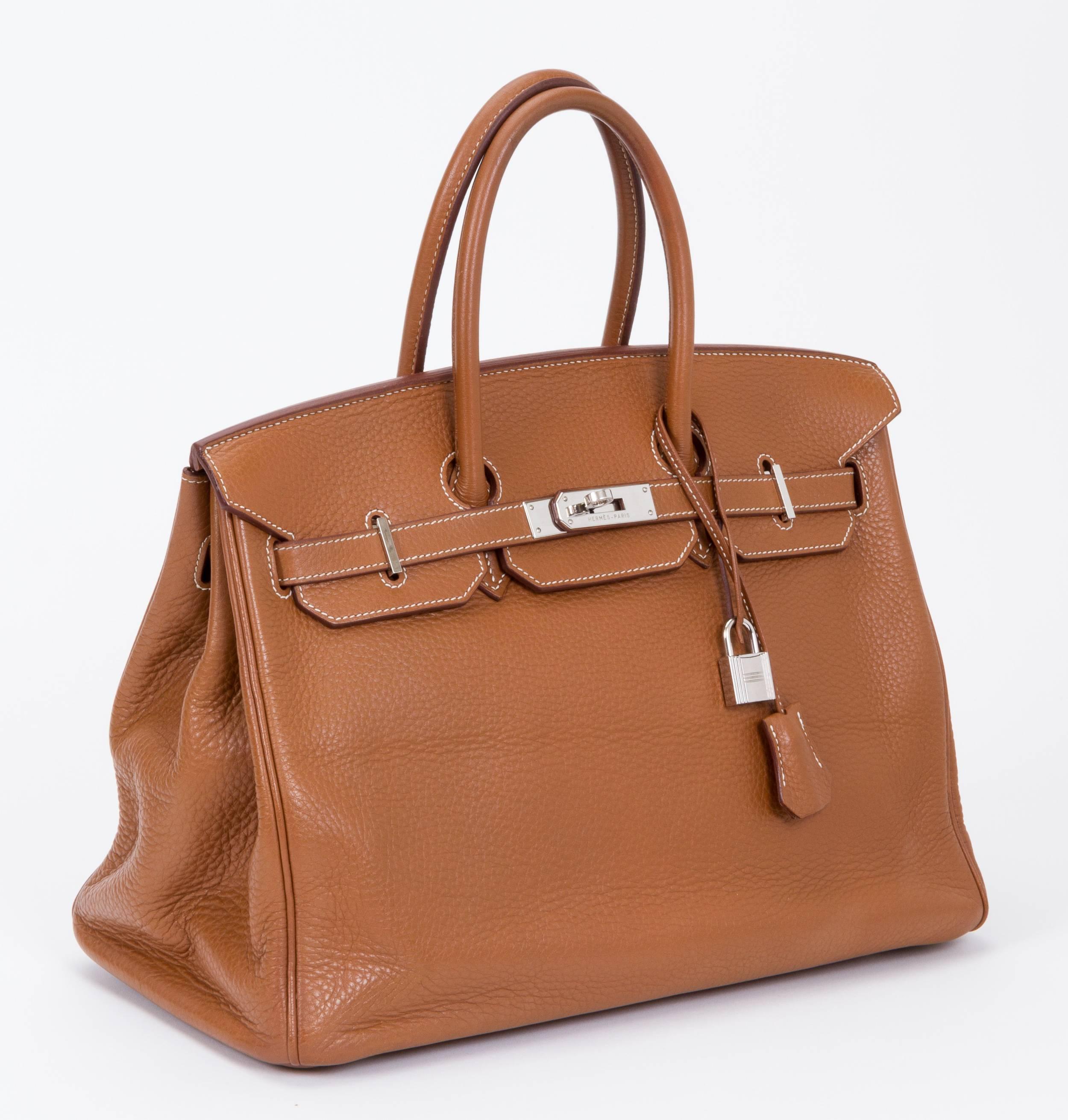 Hermès Birkin 35cm in gold clemence leather and palladium hardware. Item has been recently at Hermes spa for treatment. Clemence leather is soft and has a slouchy look. Date stamp 