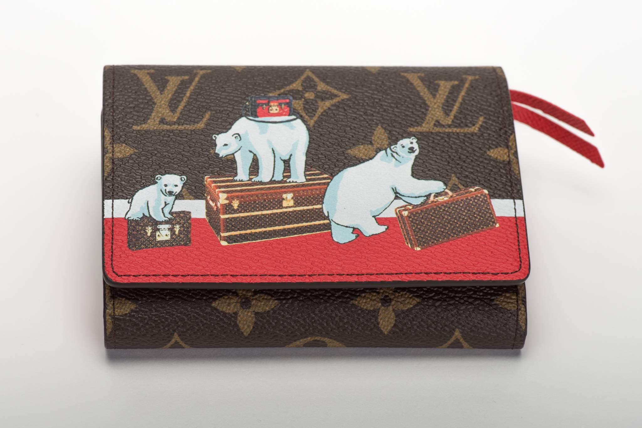 Louis Vuitton limited edition Christmas wallet with red leather interior and polar bears playing with trunks design. Brand new in box with dust cover and ribbon.