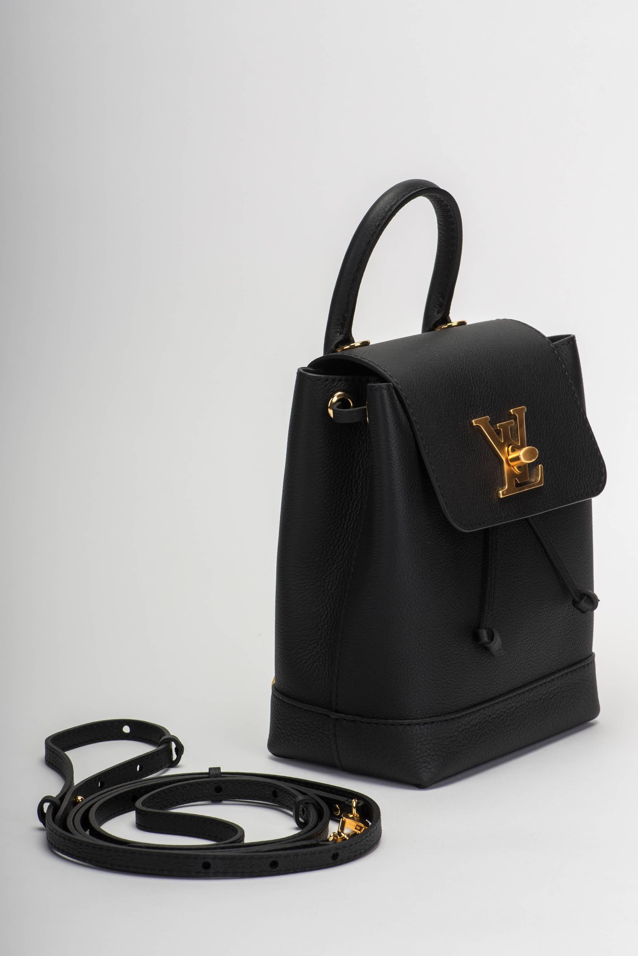 Louis Vuitton SOLD OUT limited edition lockme mini backpack in black leather and satin gold metal. Very versatile and young can be worn also as cross body. Brand new in box , comes with dust cover , box and shopper.