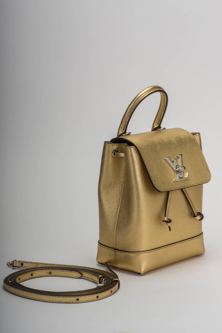 Louis Vuitton SOLD OUT limited edition lockme mini backpack in gold leather and silver metal. Very versatile and young can be worn also as cross body. Brand new in box , comes with dust cover , box, ribbon and shopper.