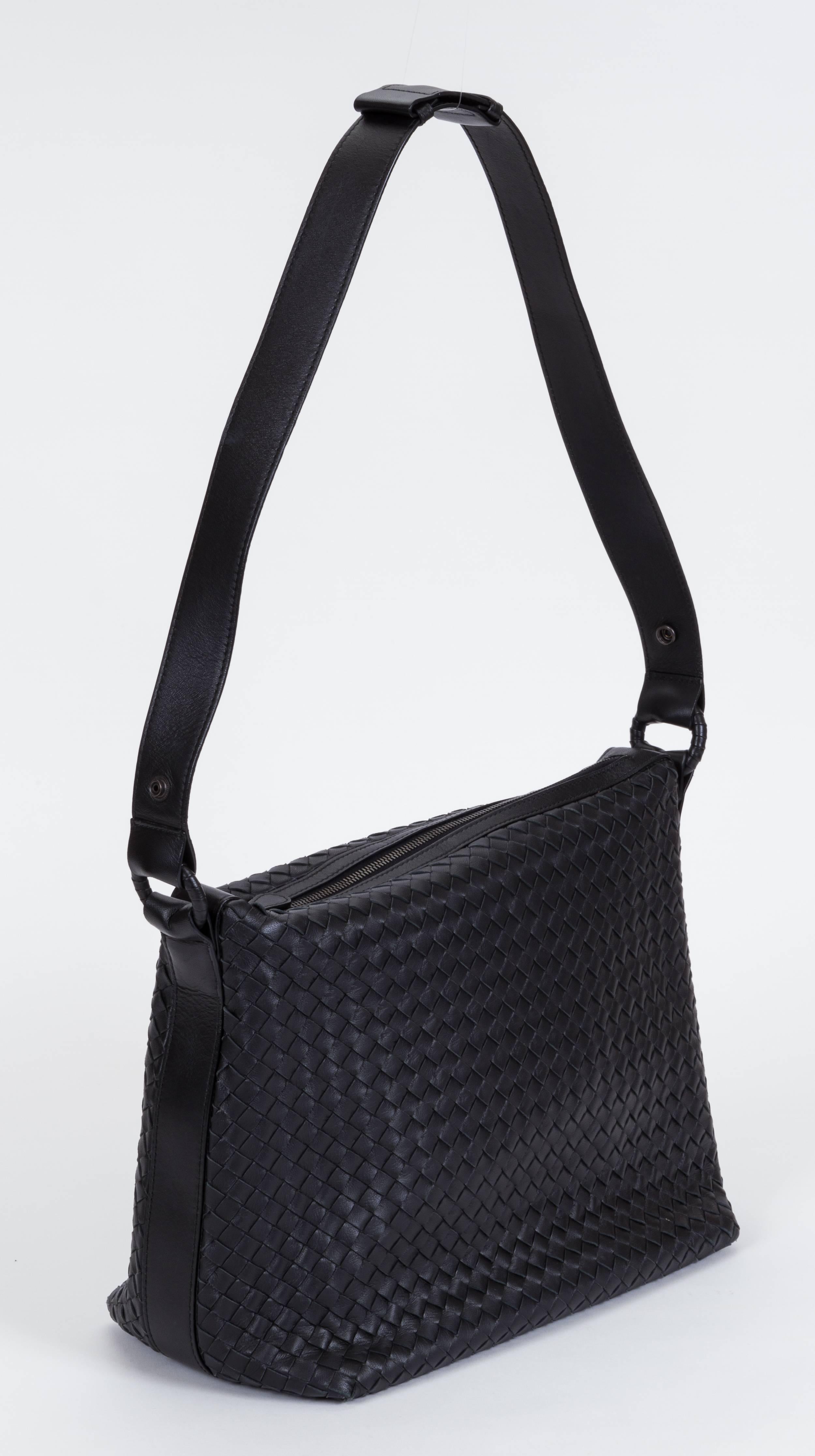 Bottega Veneta new condition black leather intricate bag with top zipper. 15
