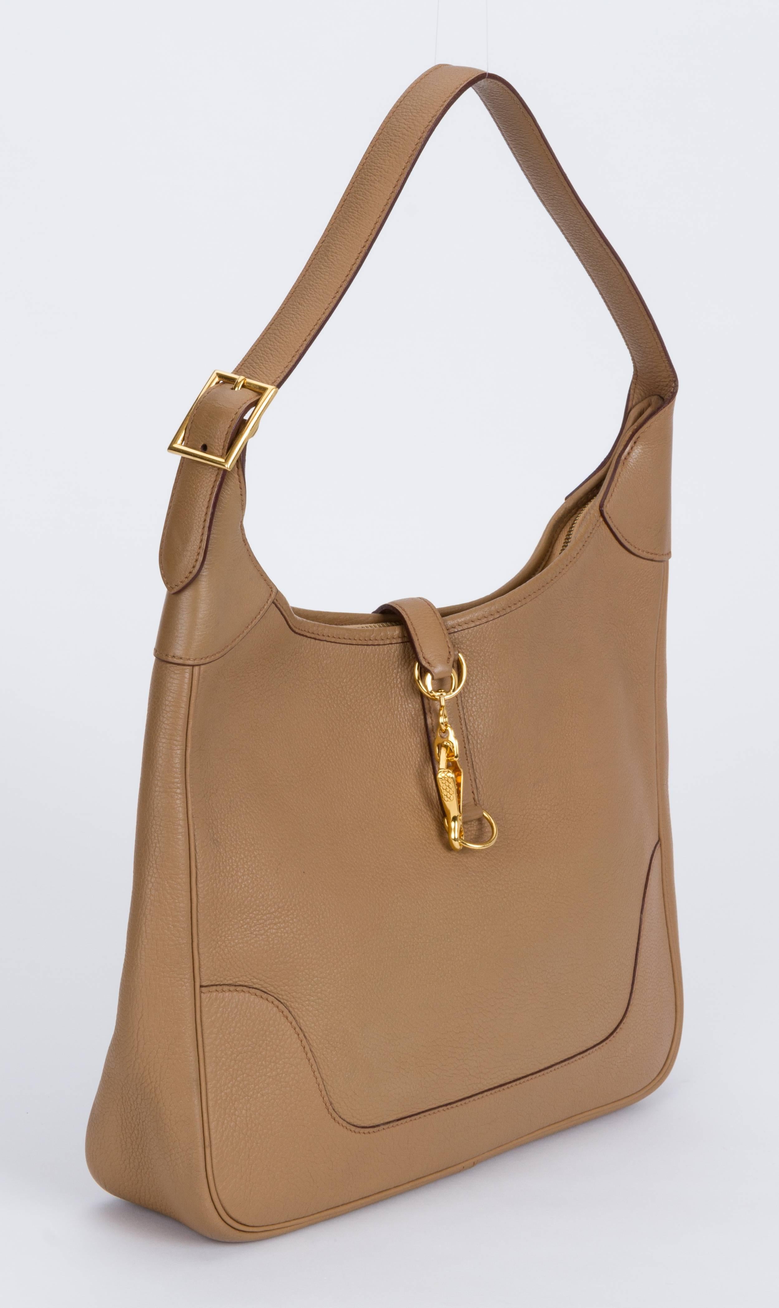Hermes trim shoulder bag in light brown togo leather and toile interior. Excellent condition. Shoulder drop 11