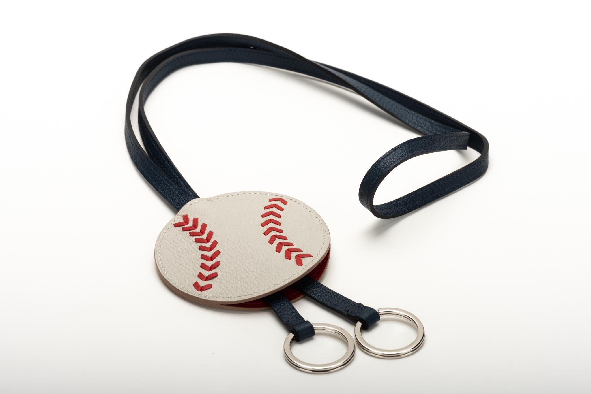 Hermes rare baseball collection keychain in blue, red and white. Comes with original box, ribbon and shopping bag.
