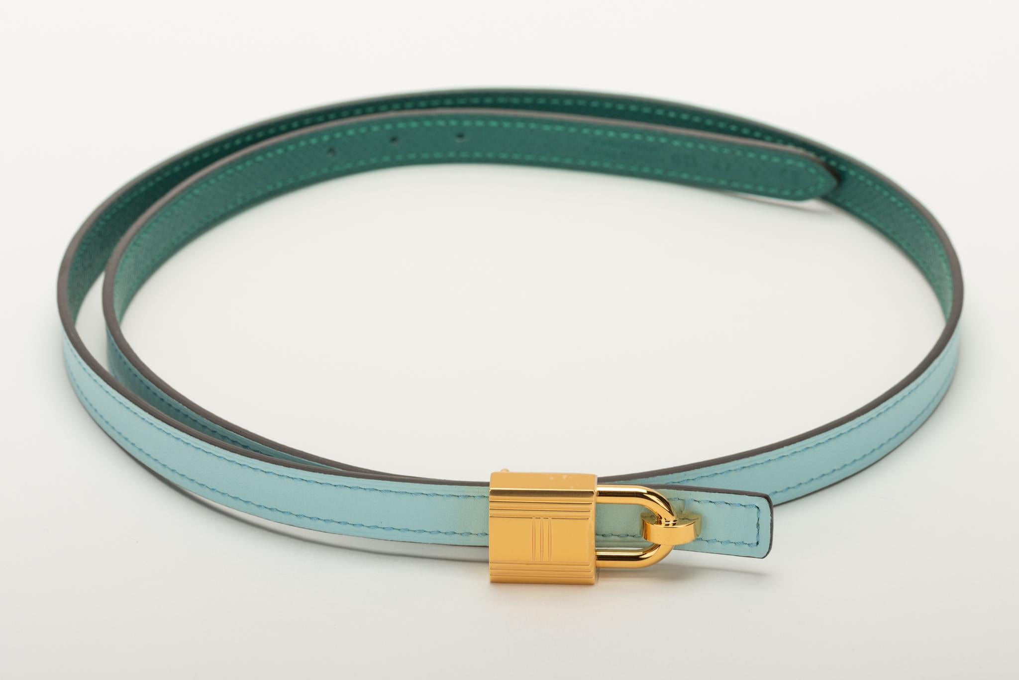 Hermes reversible thin belt in green epsom leather and blue atolle swift. Rose gold tone buckle belt. Size 85 cm, date stamp A for 2017. Comes with original box, dust cover , ribbon and shopping bag.