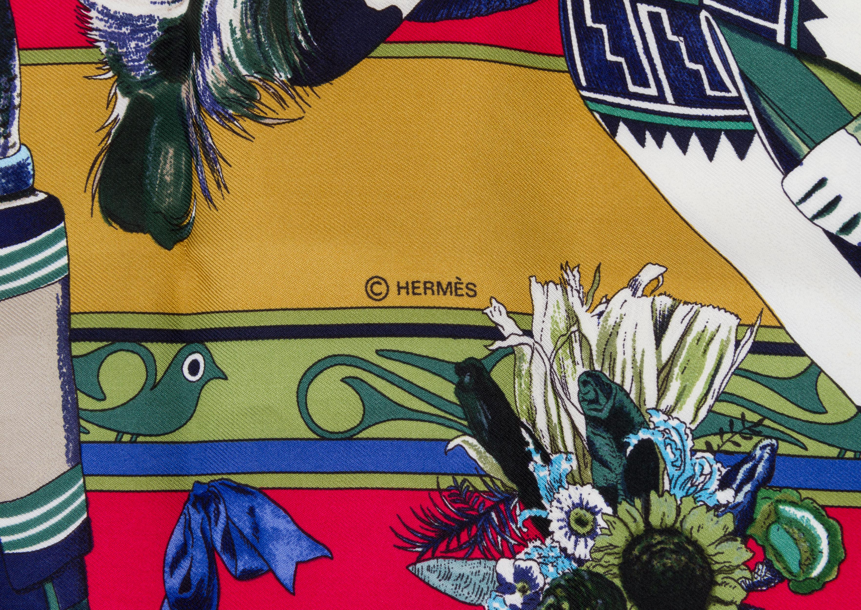 Hermès collectible and rare cherry red Kachinas  silk twill scarf. Hand-rolled edges. Comes with original box.