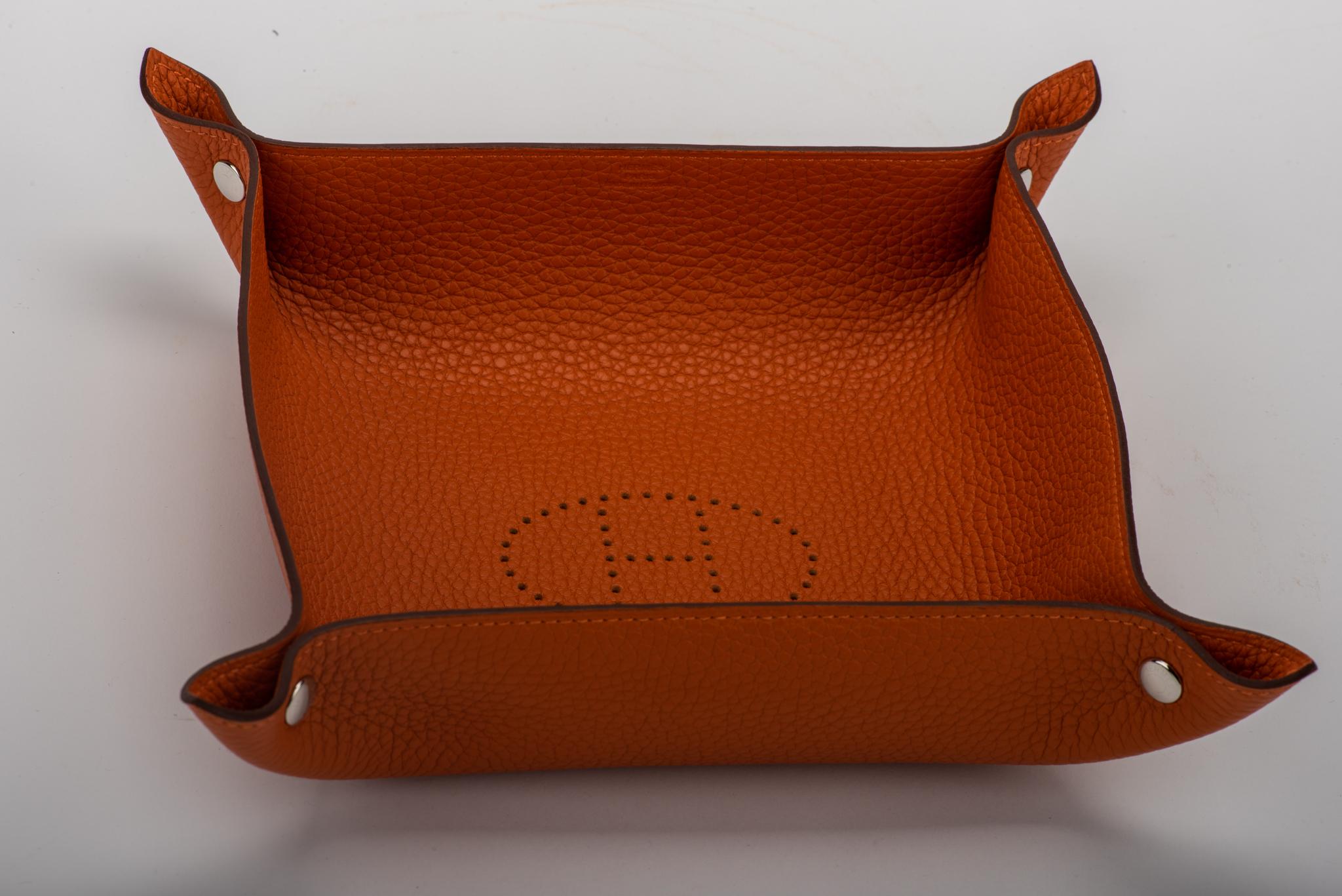 Hermès orange taurillon clemence leather and palladium hardware change tray. Date stamp C for 2018. Brand new in box.