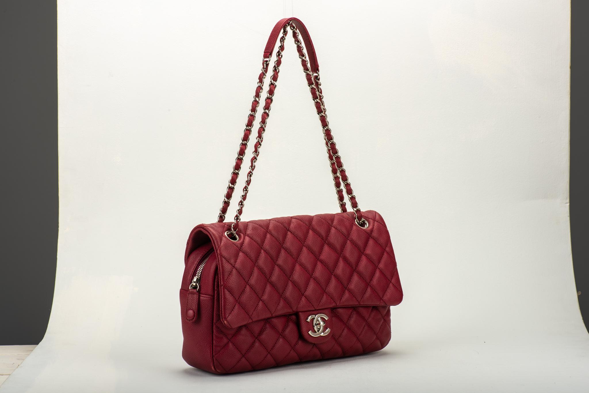 Chanel cherry red caviar jumbo flap with zipped closure. Shoulder drop 10.5