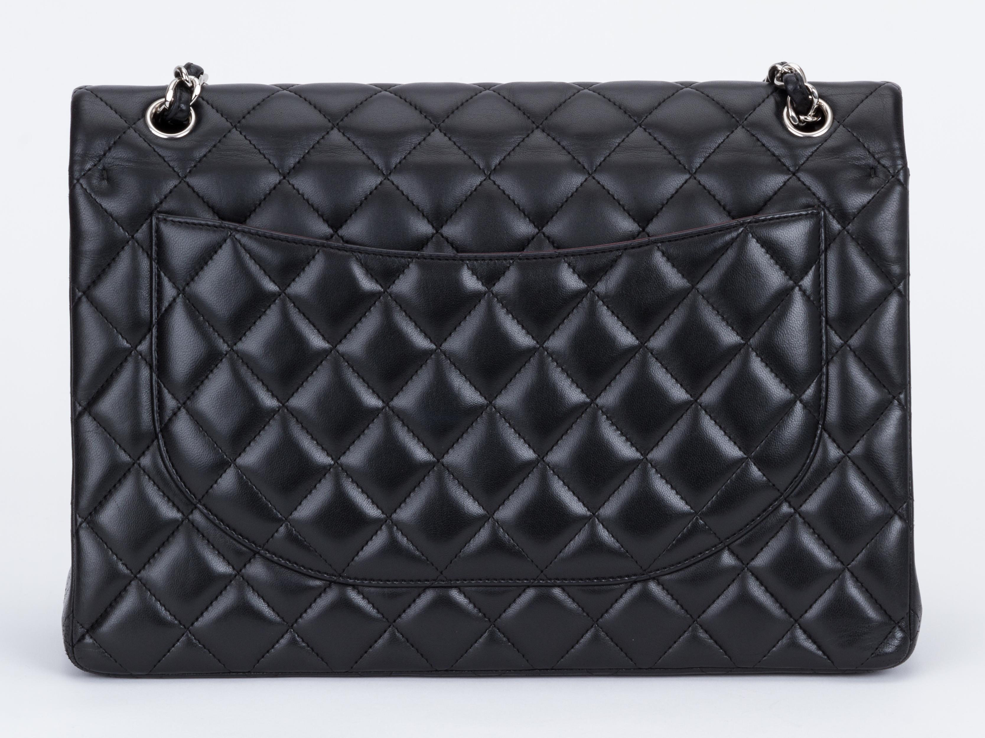 Chanel Black Lambskin Maxi Double Flap Bag In Excellent Condition In West Hollywood, CA