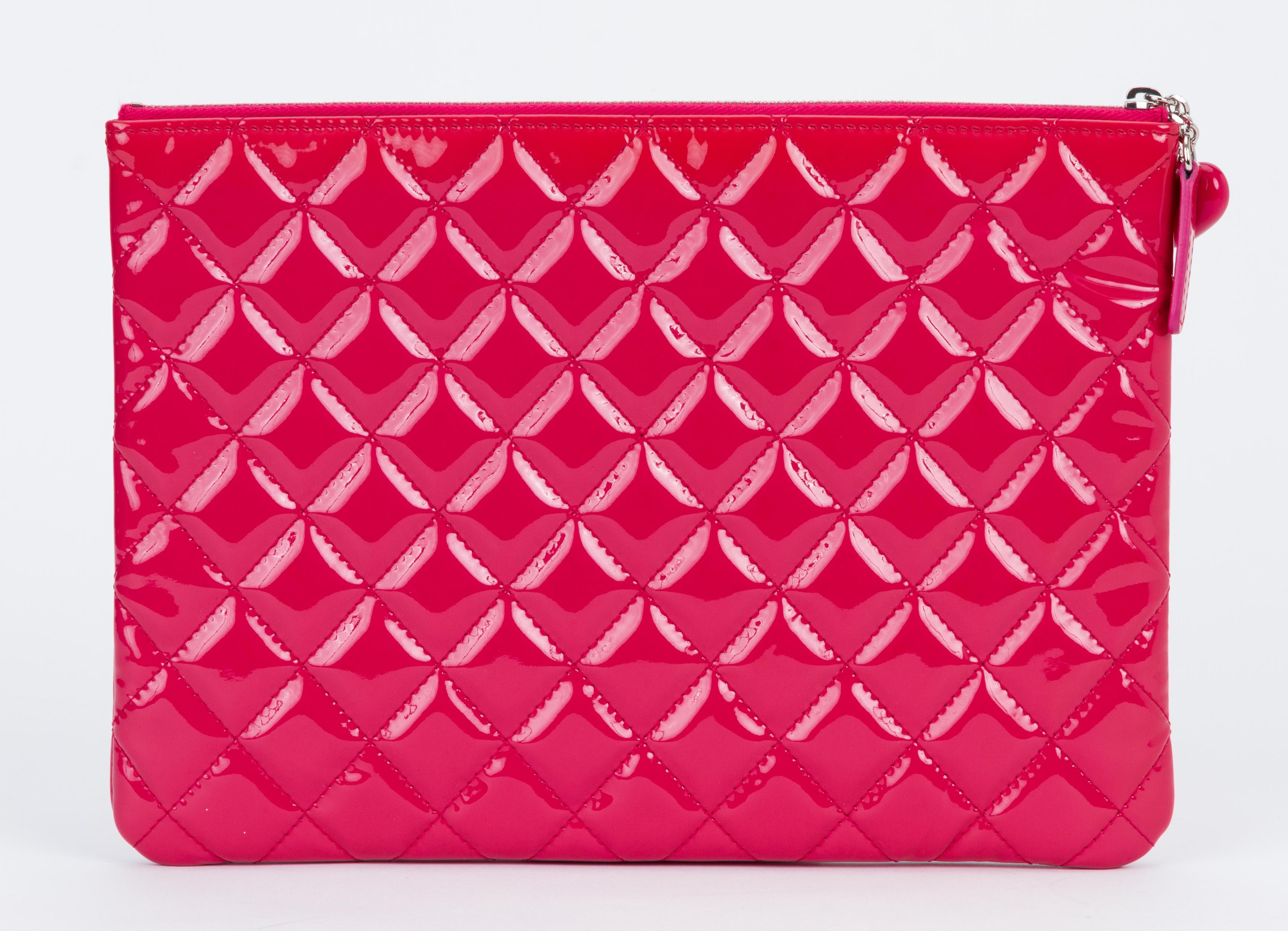 pink patent clutch bag