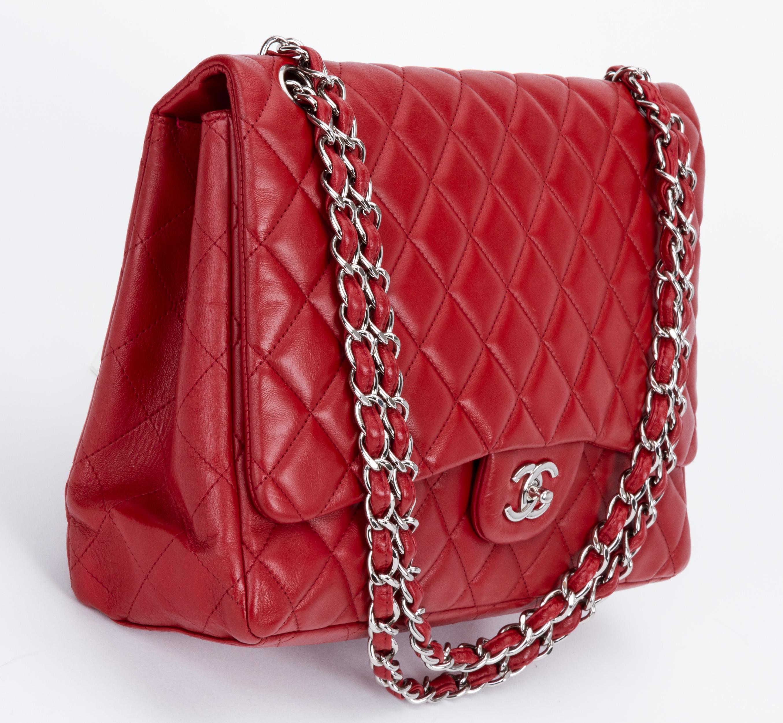 Chanel red maxi quilted lambskin single flap bag. Silver tone hardware. Collection 2009/2010. Comes with hologram, booklet, id card and original dust cover. Recent Spa treatment executed by professional. Store price $9200.