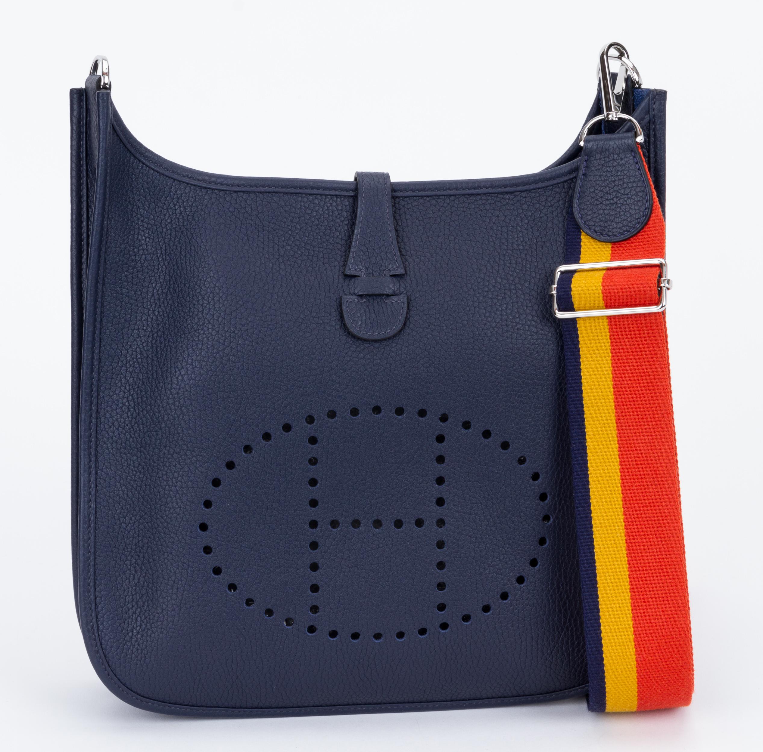 NEW rare Hermès blue nuit/blue marine clemence leather medium evelyne with palladium hardware. Adjustable multicolor shoulder strap, can be worn cross body. Date stamp C in a square, 2018. Comes with original duster, shoulder strap, box, ribbon.