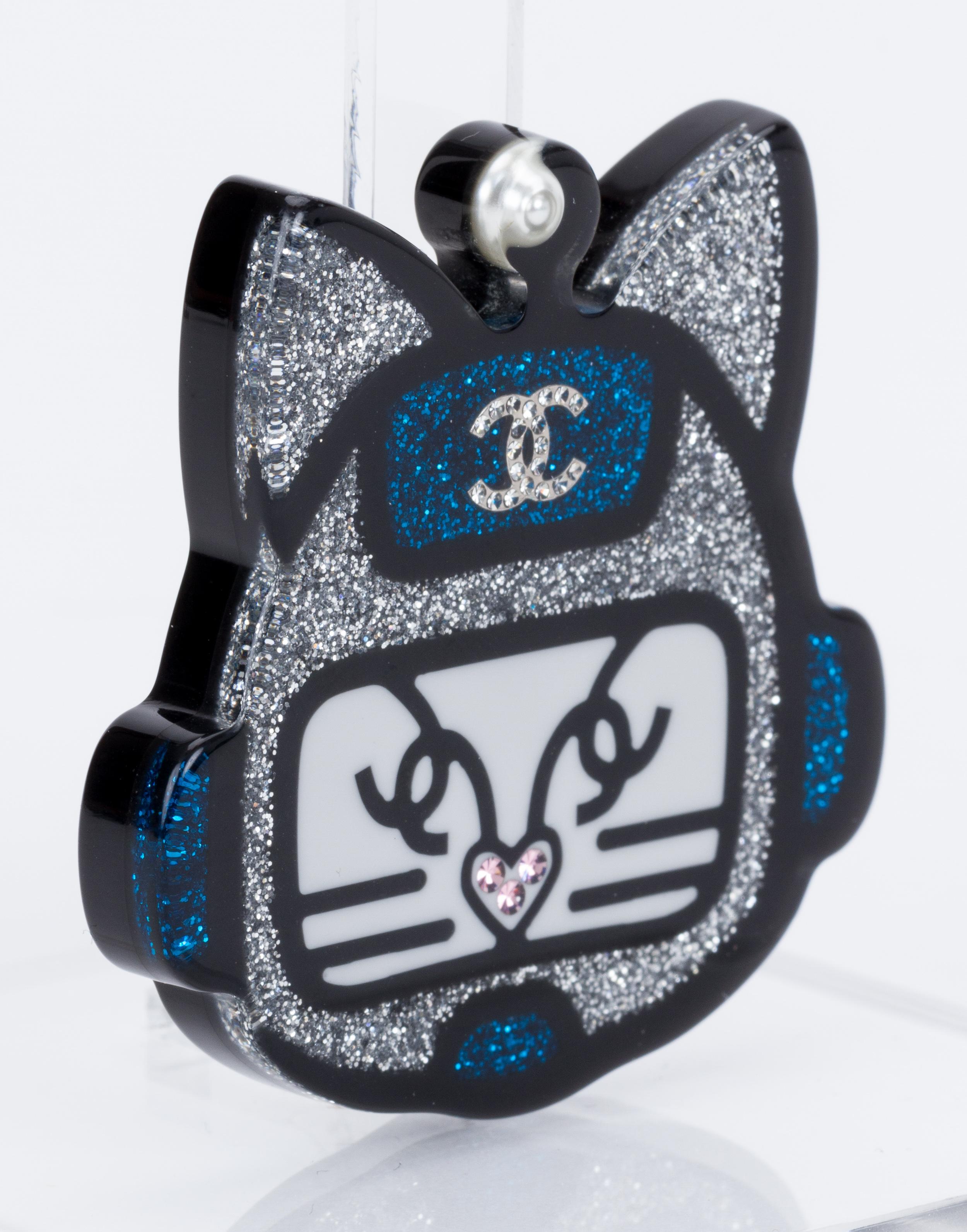 Chanel new silver and blue lucite cat face pin. Collection spring 2017. Comes with original box and ribbon.