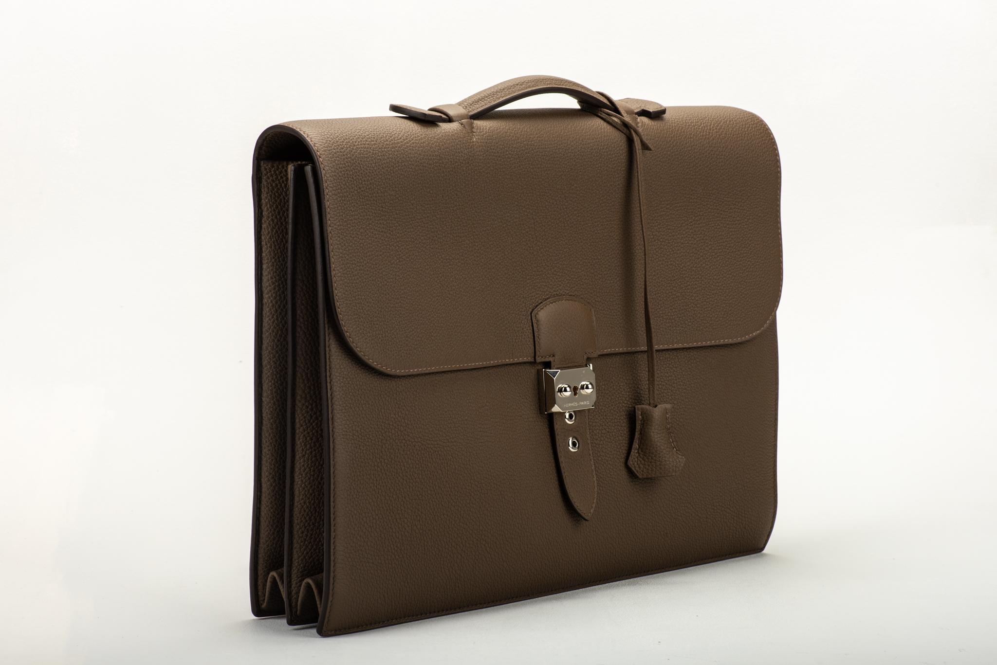 Hermes new condition etain togo leather briefcase, sac a depeche 38cm, with palladium hardware. Date stamp R for 2014. Comes with 2 keys and original dust cover.