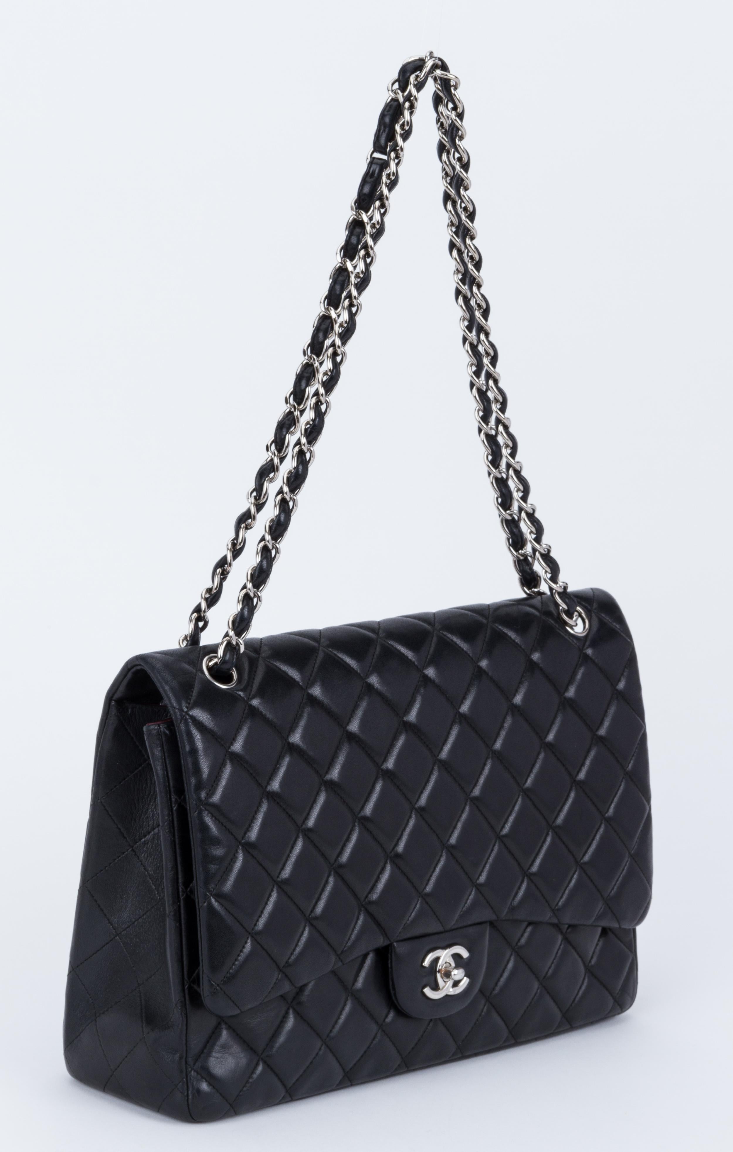 Chanel black quilted lambskin maxi single flap with silver tone hardware. Shoulder drop 11