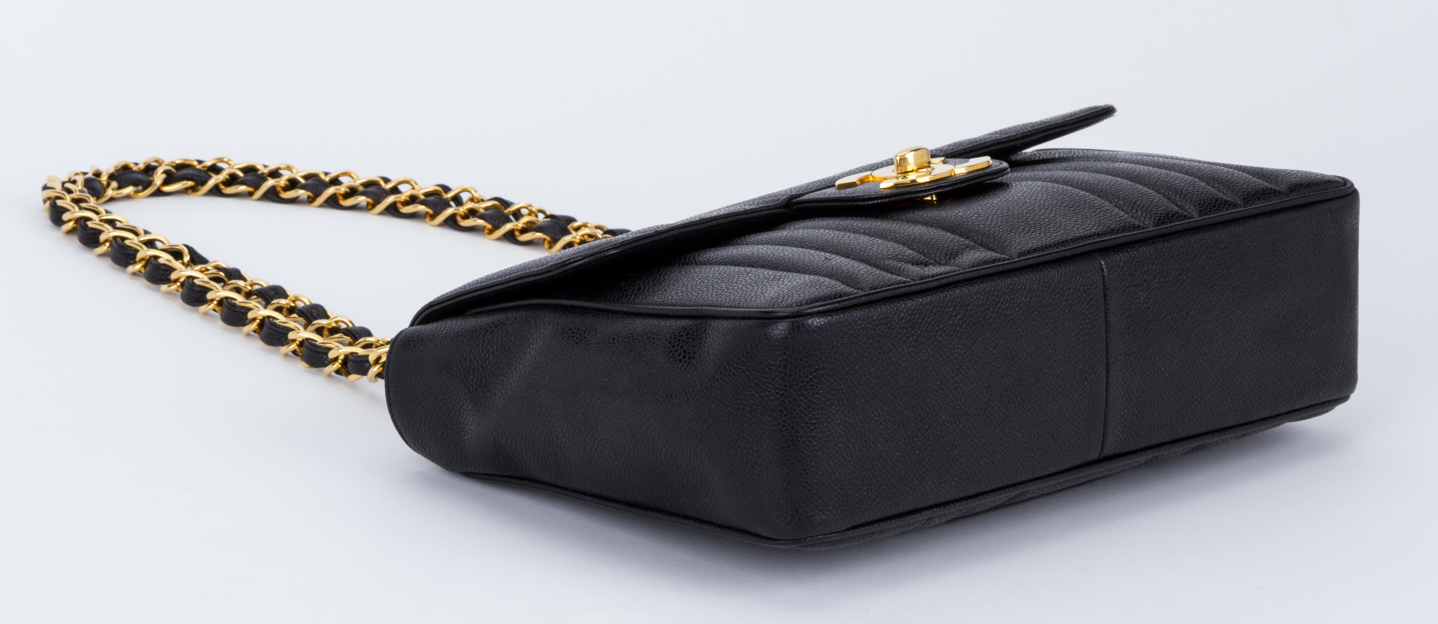 Women's Chanel Black Caviar Vertical Jumbo Flap