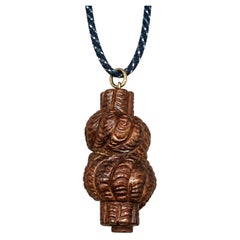 Pendentif « nœud d'amour » en bois de rose sculpté à la main