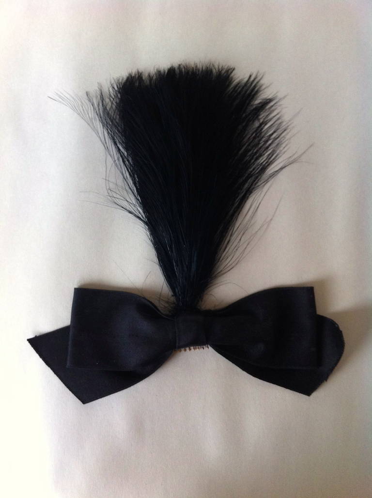 Chanel haute Couture, by Karl Lagerfeld, circa 1984

Black crinoline-and-aigrette-feather coiffure. Opulent black-dyed -aigrette feathers on Chanel iconic black silk stiff ribbon, back mounted by the house of Lemarié with ...
