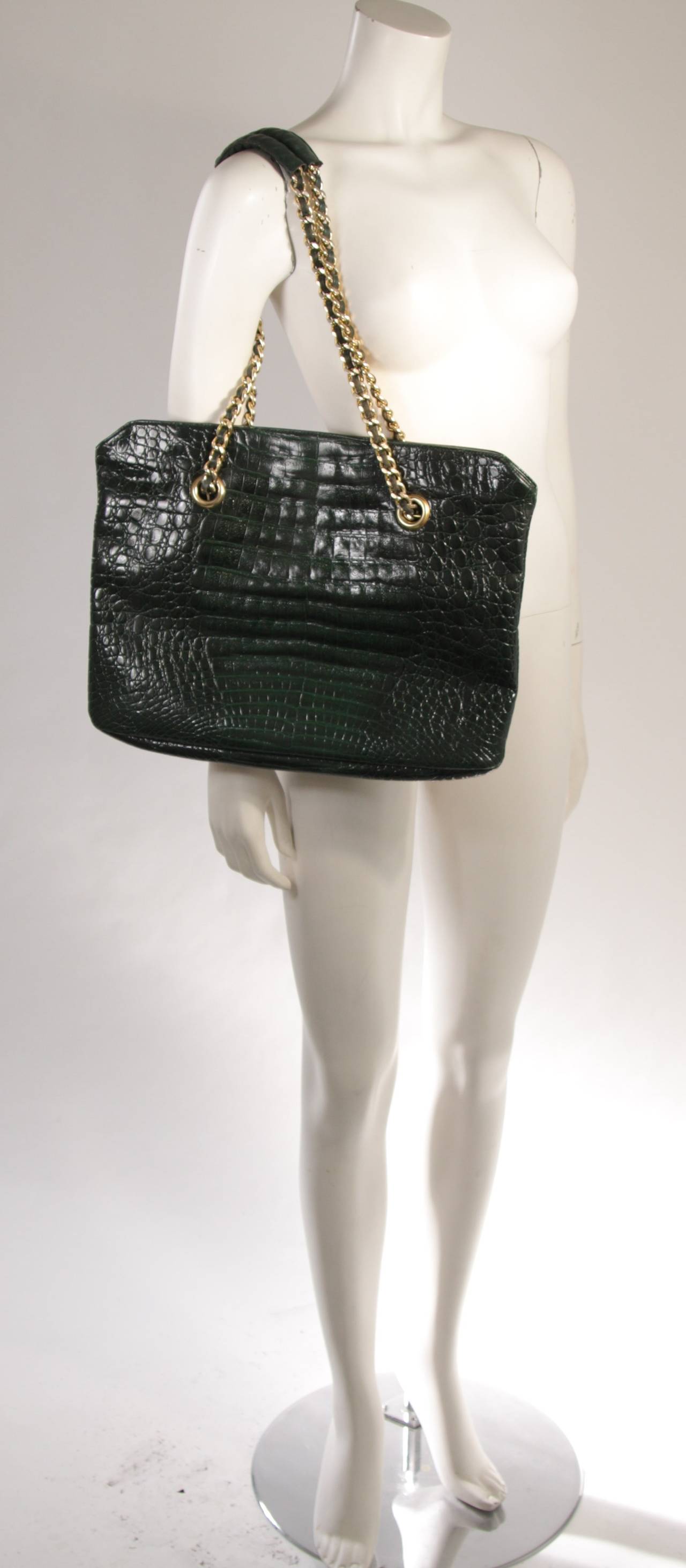 This La Bagagerie design is available for viewing at our Beverly Hills Boutique. This fabulous design features a double strap chain design with a top zipper closure and one interior zipper compartment. In great vintage condition. Made in France.