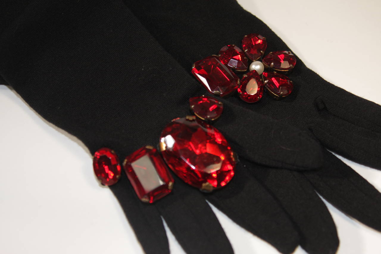 These fantastic Dolce and Gabbana gloves are available for viewing at our Beverly Hills Boutique. The gorgeous pair of gloves are composed of a black stretch wool blend, with a generous amount of stretch these gloves fit most sizes. Made in Italy.