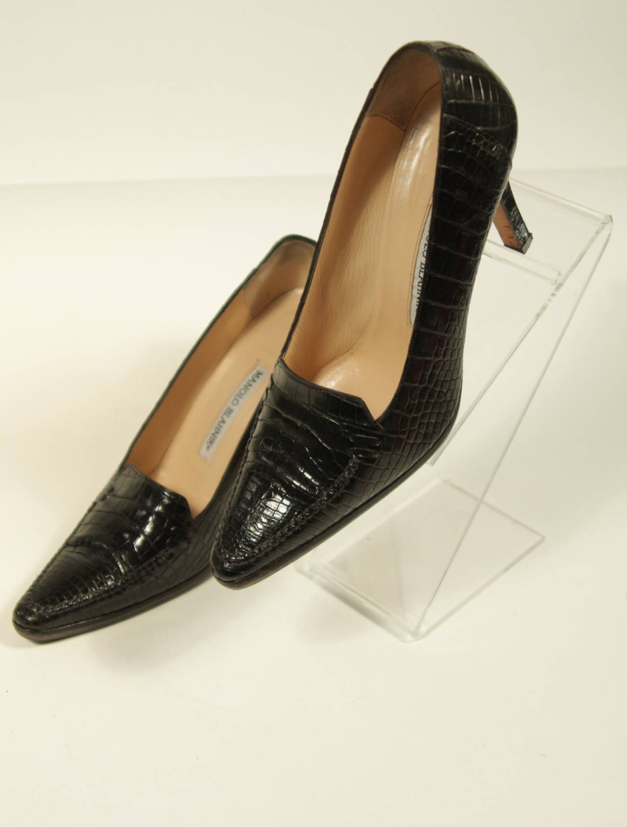 These Manolo Blahnik  black crocodile heels are in excellent condition and have been resoled with a sole providing more traction and comfort. Made in Italy. 

Measures (Approximately)
Size 38
Interior length: 10