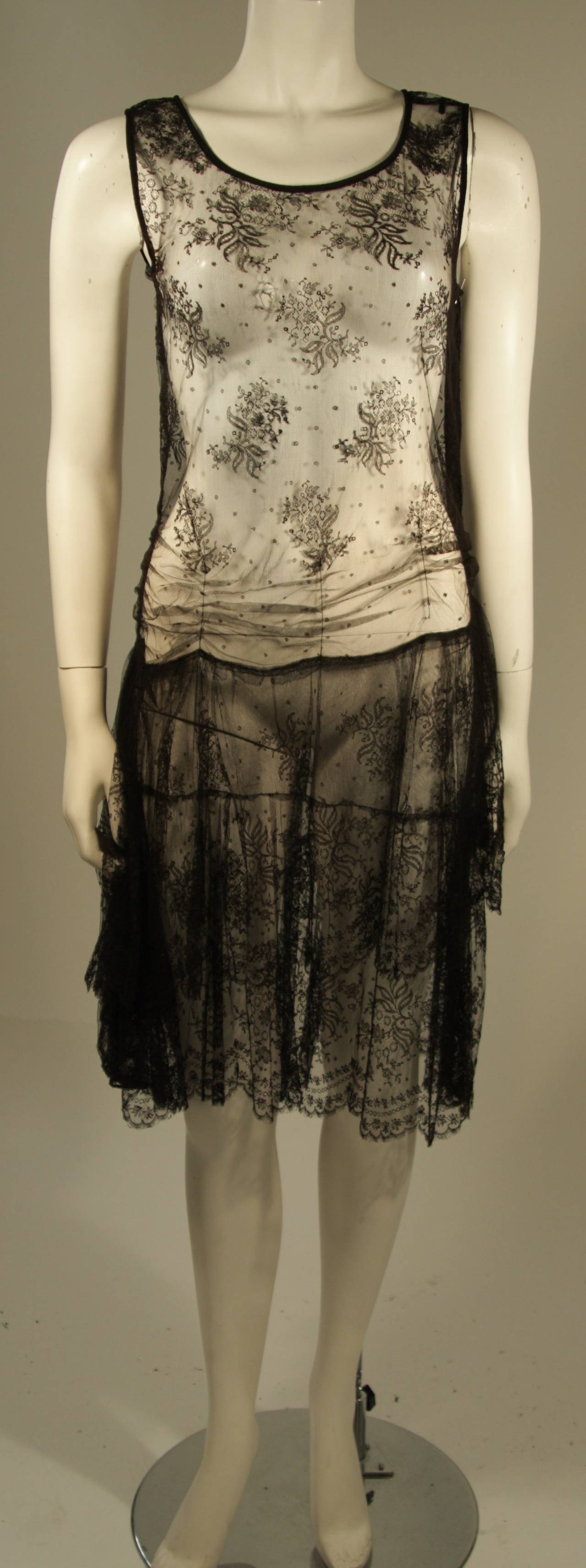 This dress is composed of a black French lace and features a drop waist design. A great piece. 

Measures (Approximately)
Length: 40.5