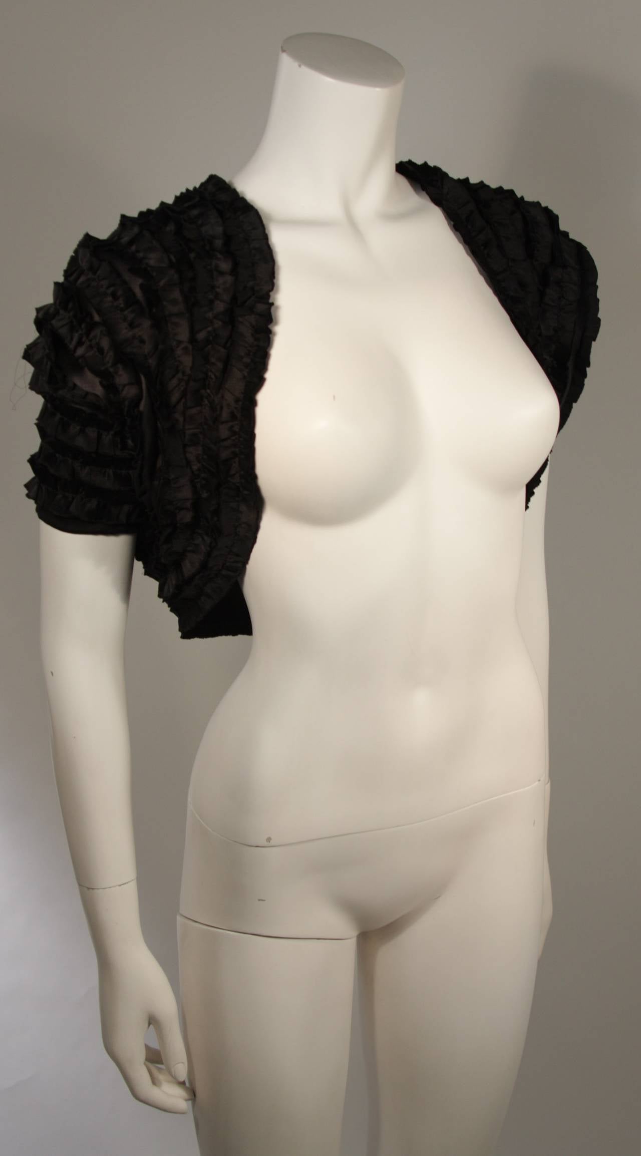 Elizabeth Mason Couture ruffled bolero
Black silk 
Size 2 
Measures  13.5